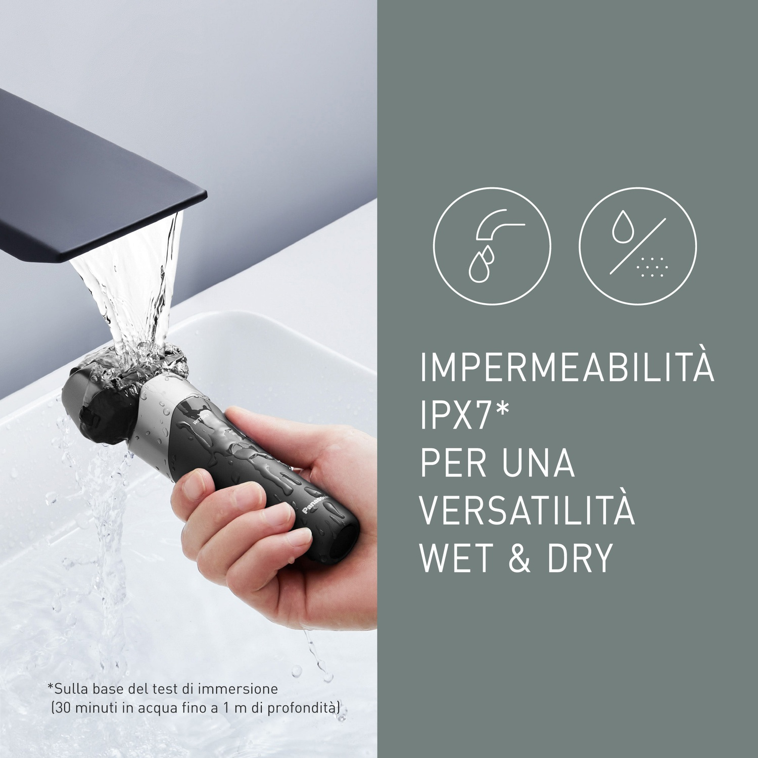 Un rasoio nero sciacquato sotto acqua corrente. Impermeabile IPX7.