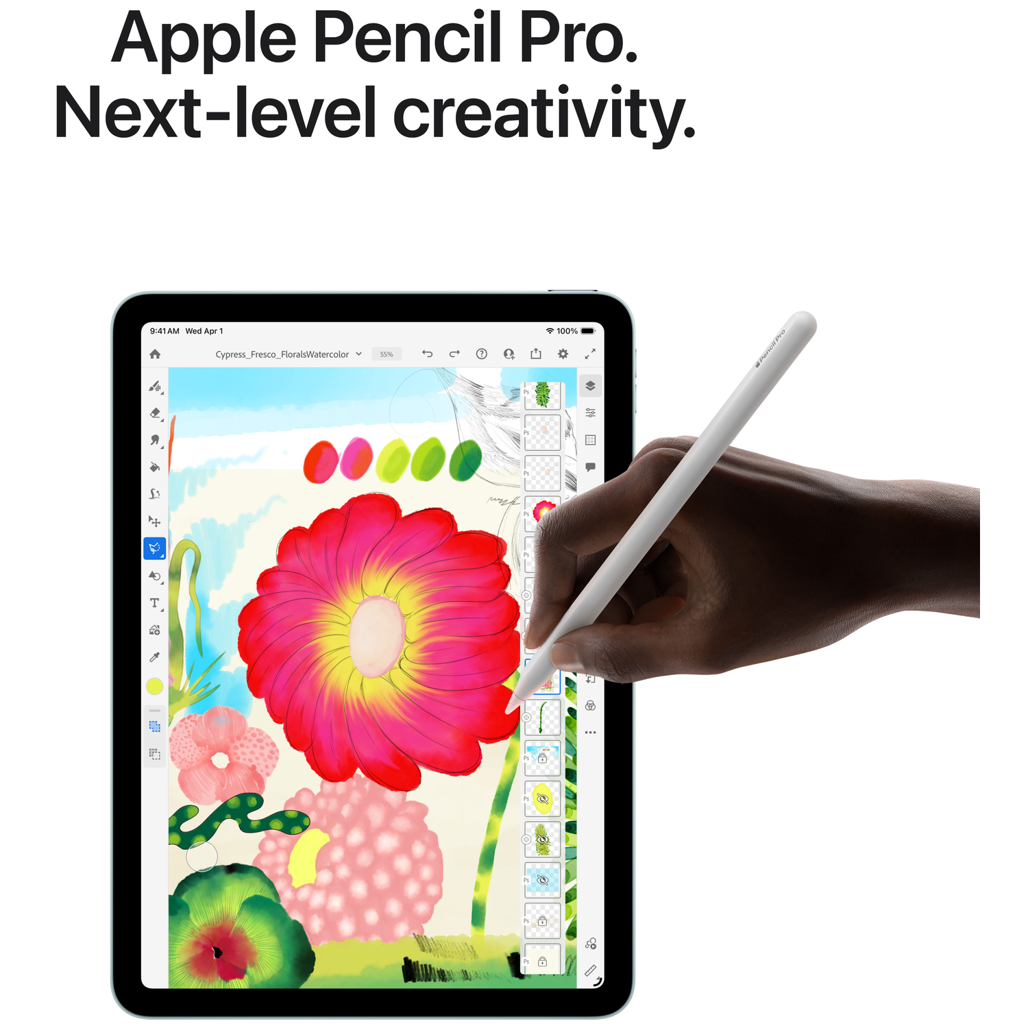 Main tenant Apple Pencil Pro blanc dessinant une fleur rouge sur écran tablette.