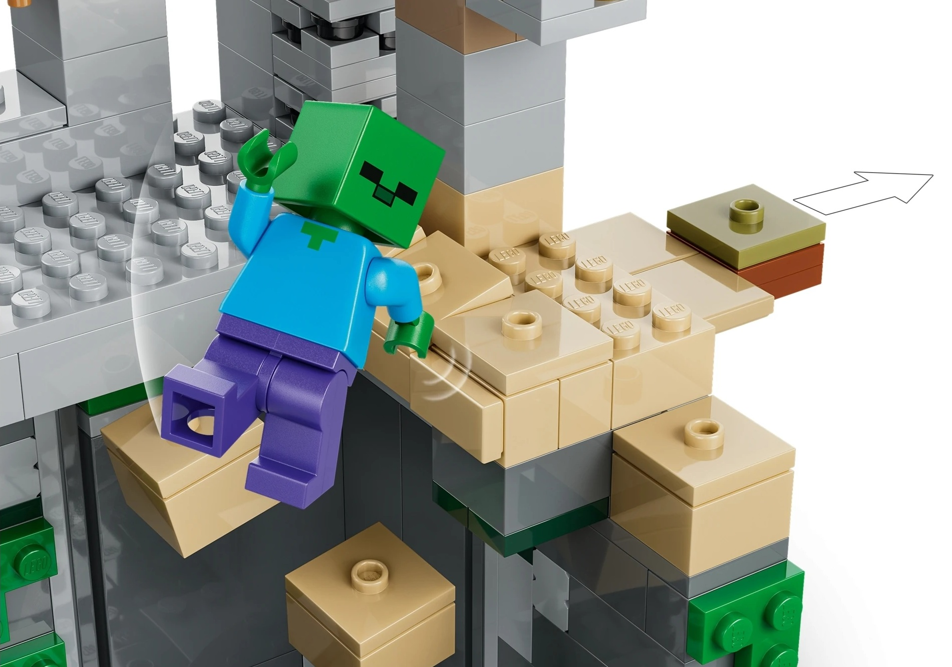 Zielony zombie Lego w niebieskiej koszuli i fioletowych spodniach spada na brązowe klocki.