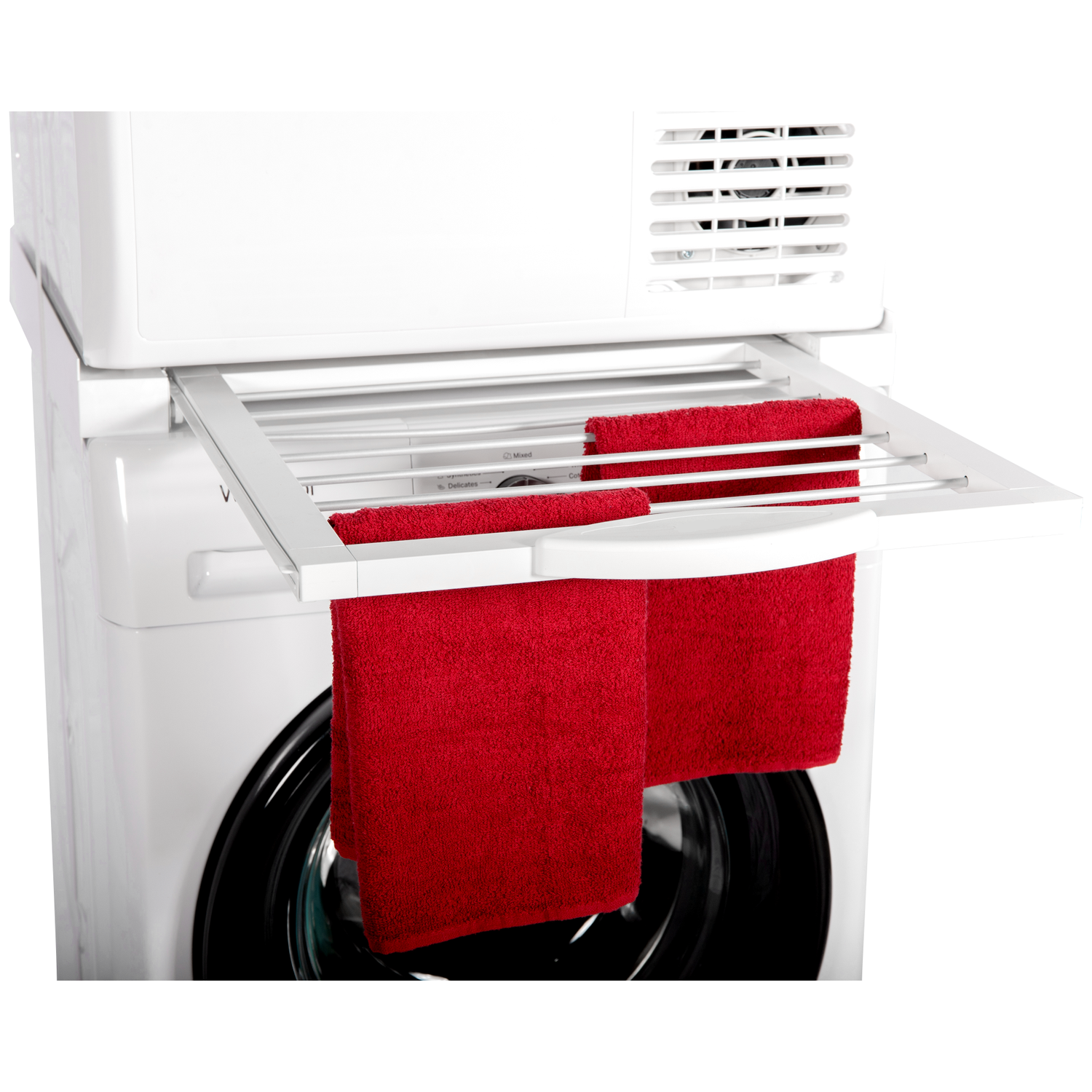 Two red towels hang on a pull-out drying rack above a washing machine.