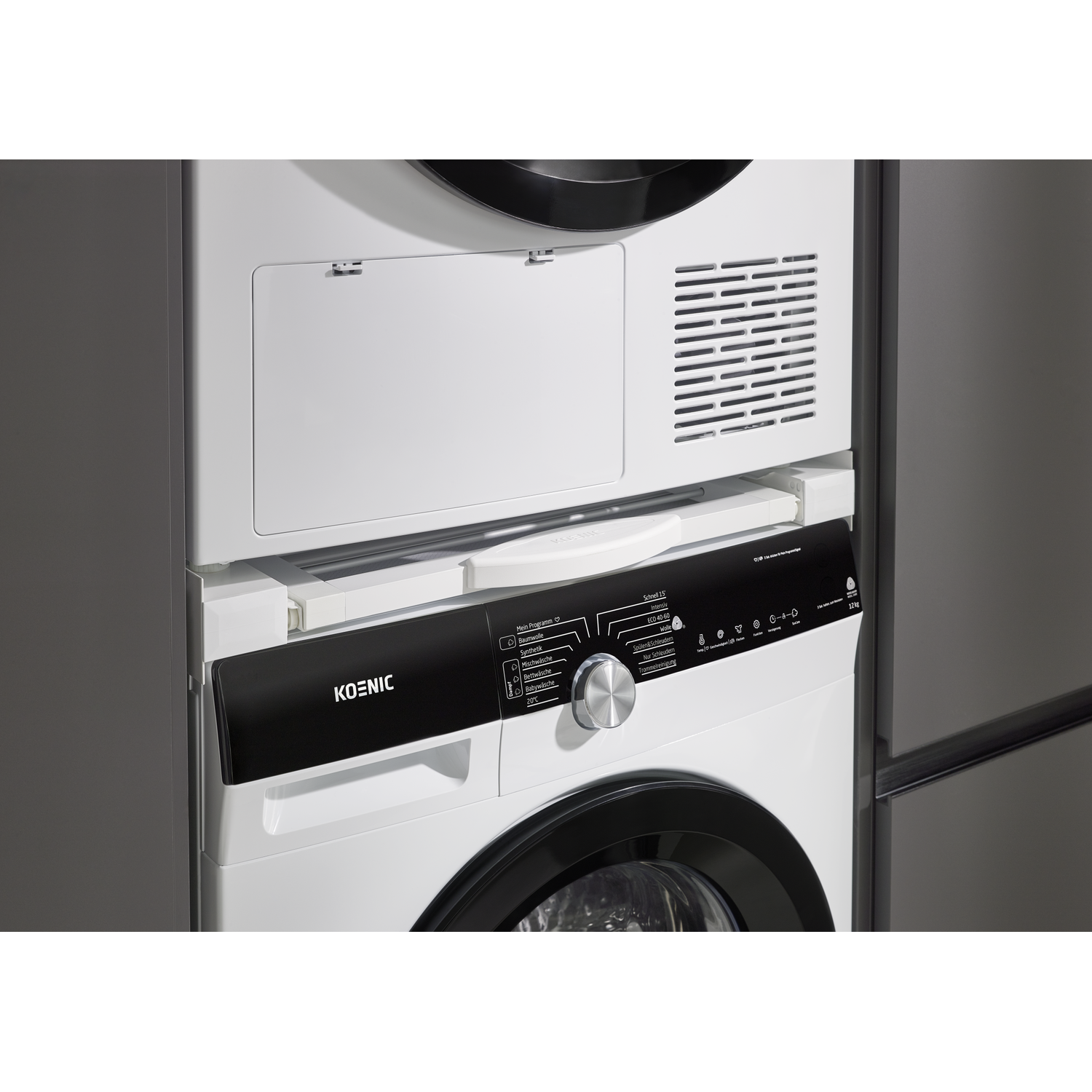A white washing machine with a black control panel and silver dial.