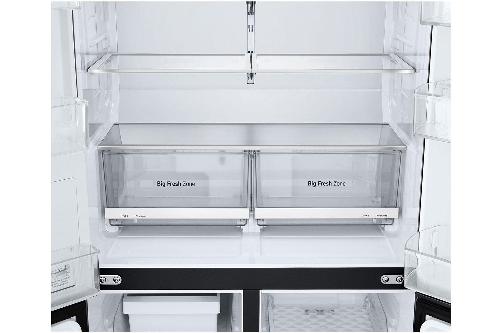 Innenraum eines Kühlschranks mit Glasböden und zwei „Big Fresh Zone“-Schubladen.