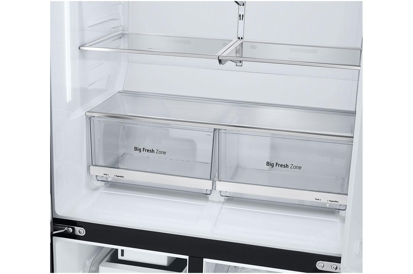 Innenansicht eines Kühlschranks mit zwei transparenten Schubladen.