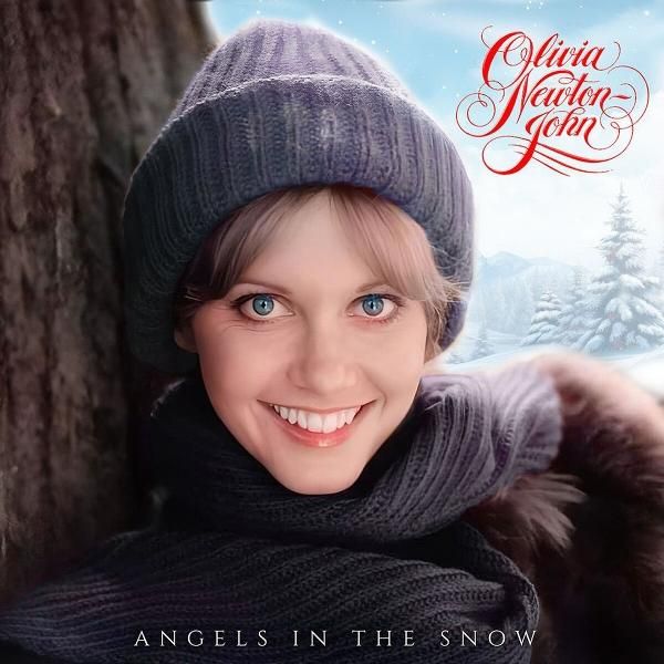 Olivia Newton-John im Winter mit Mütze und Schal, lächelnd.