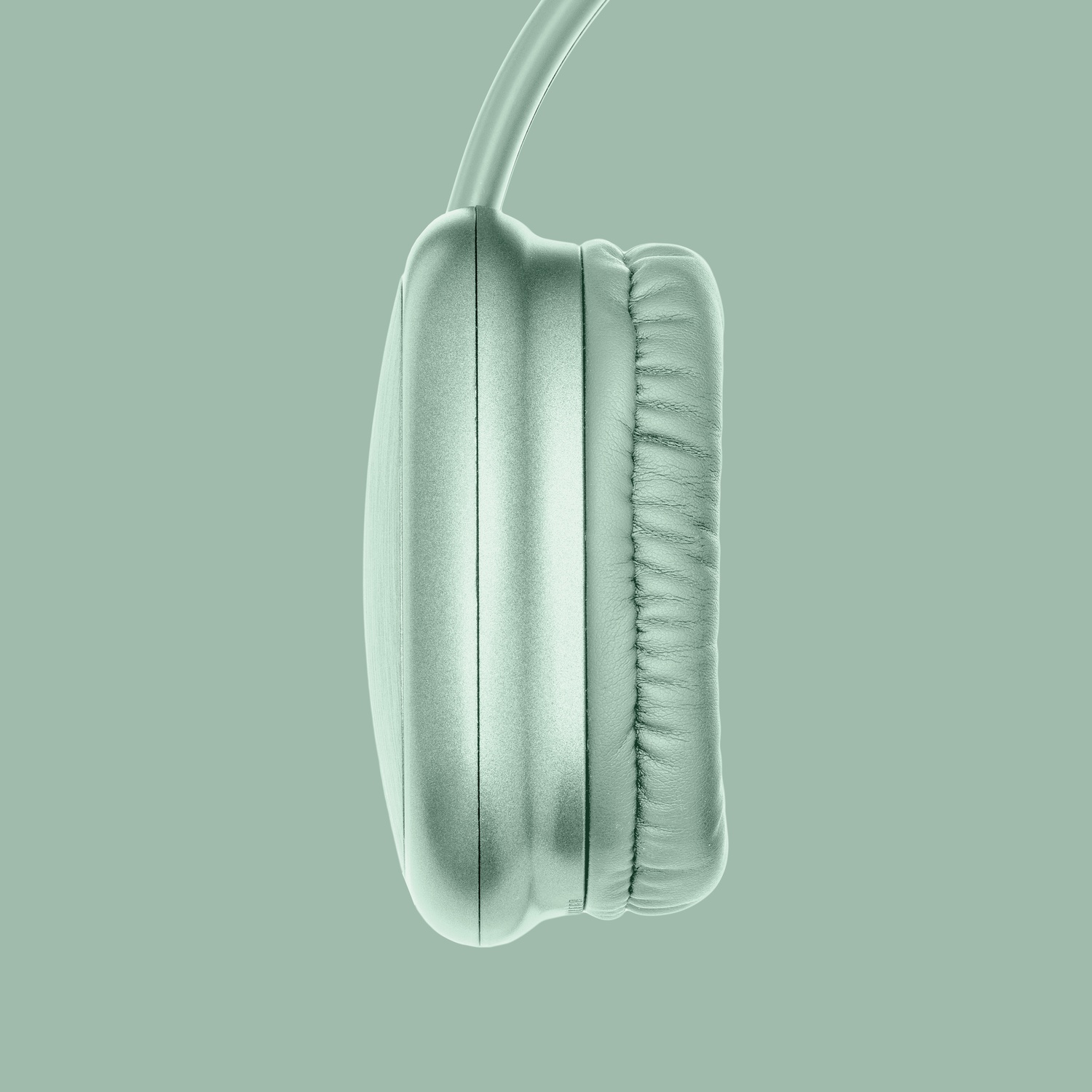 Cuffia verde menta con auricolare e fascia su sfondo grigio.