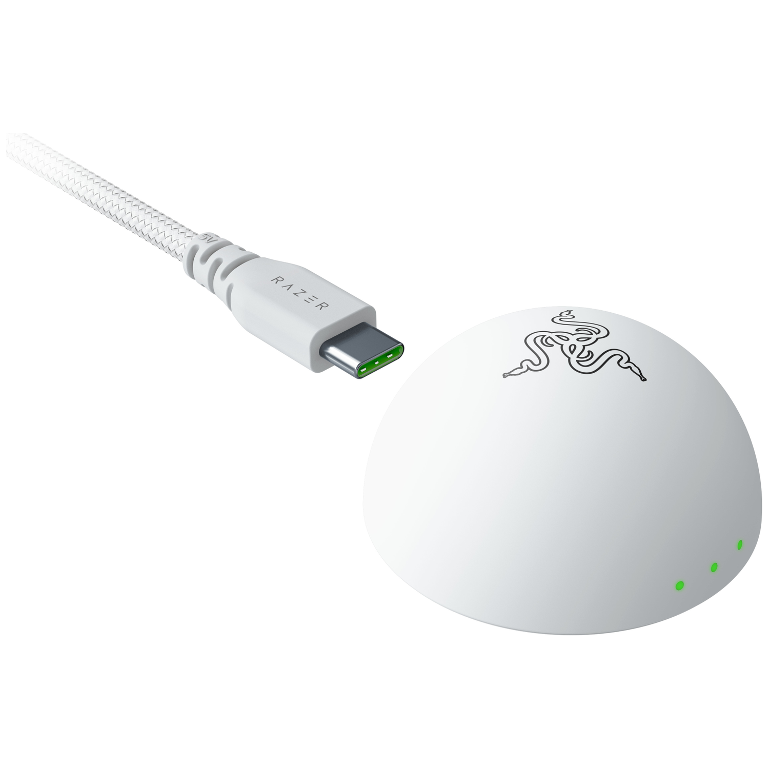 A white USB-C cable with Razer logo next to a white round charging dock with green lights.