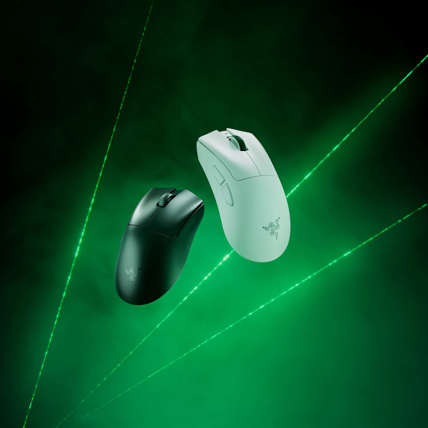 Two mice, one black, one white, with green laser lines in the background.