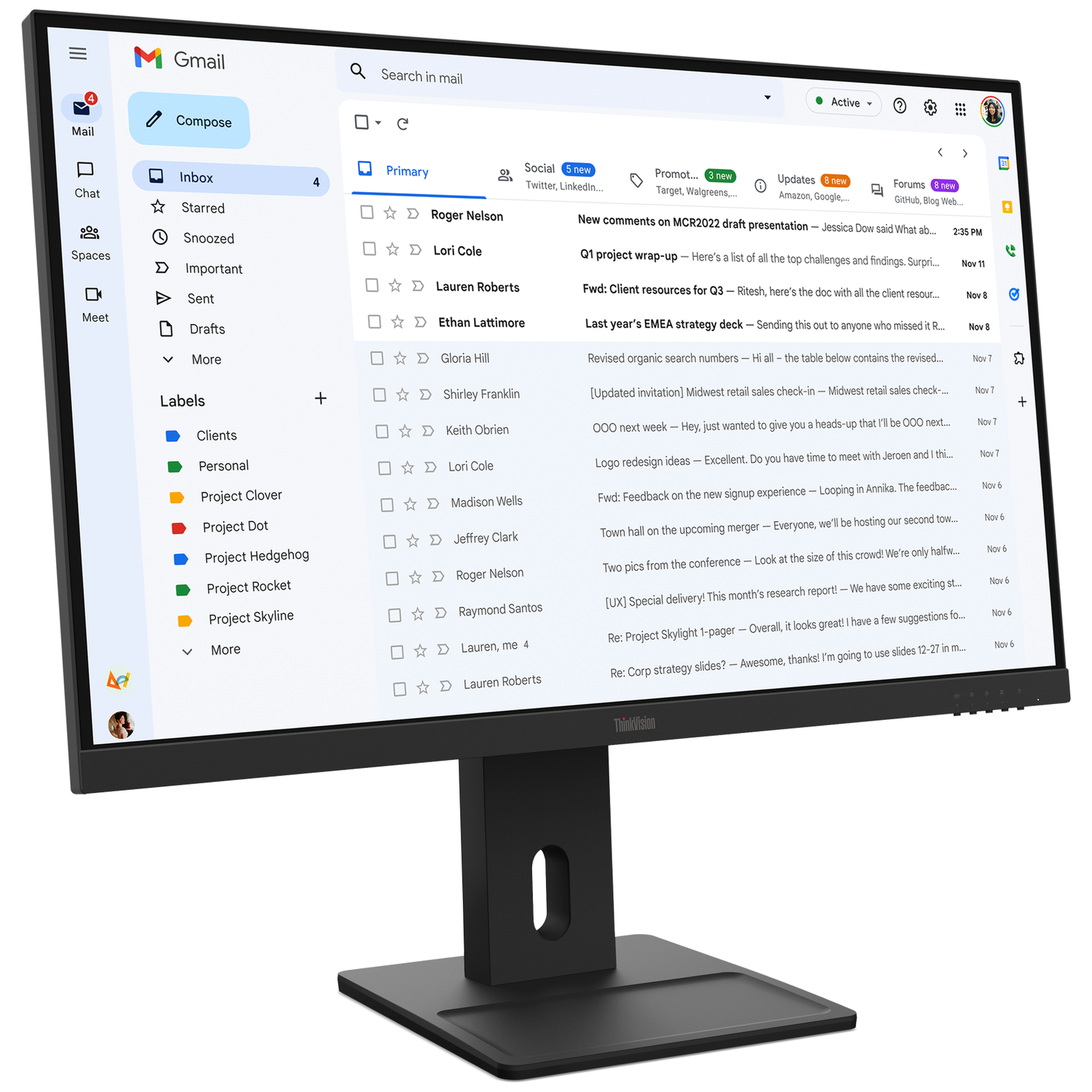 A computer monitor displays the Gmail interface with a list of emails.