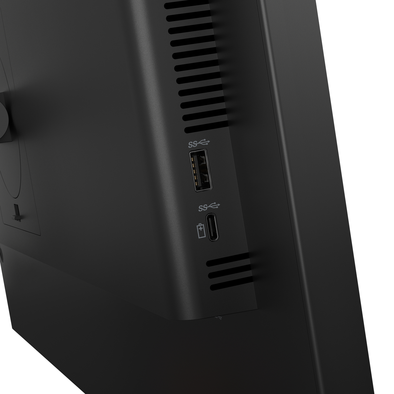 Close up of a black computer with ventilation slots and USB ports.