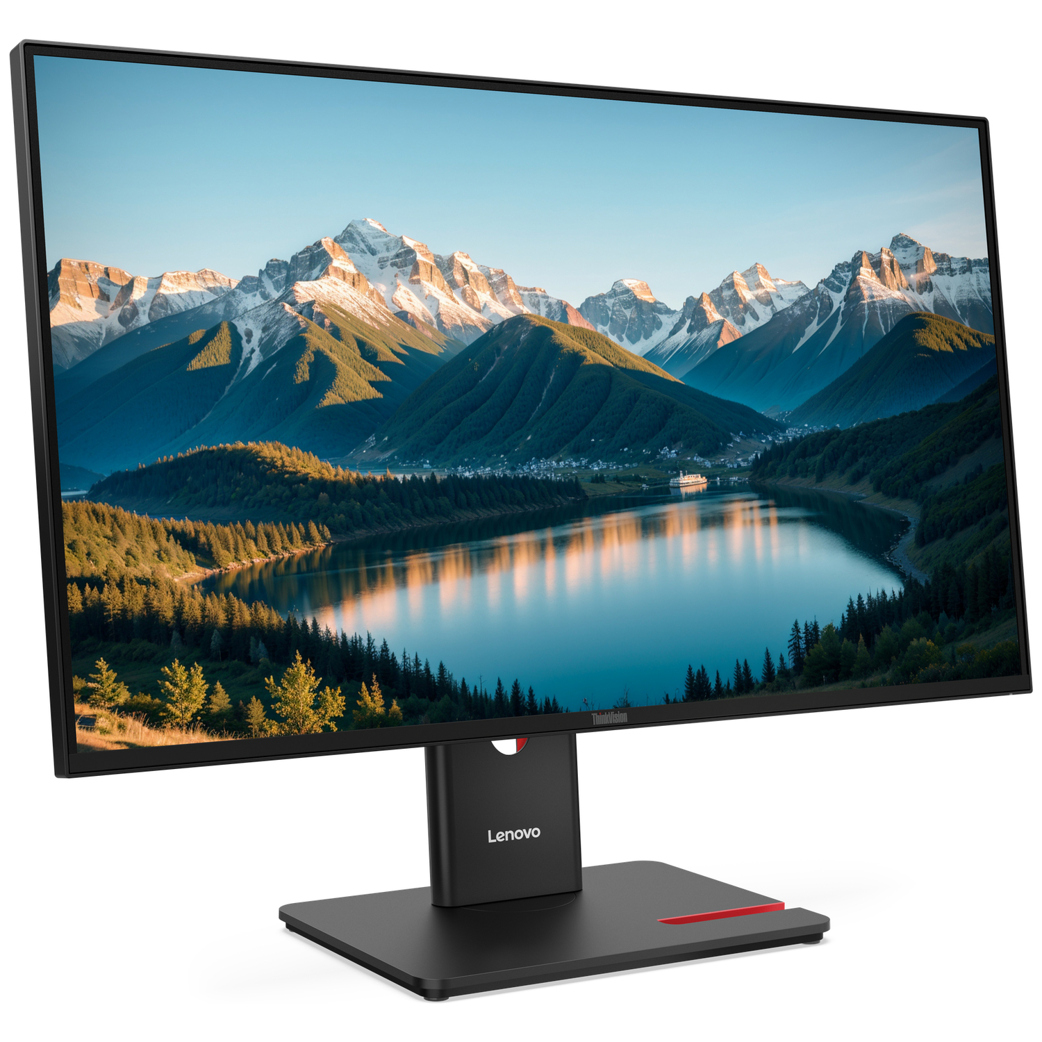 A monitor displays a mountain landscape with a lake, trees, and a village.