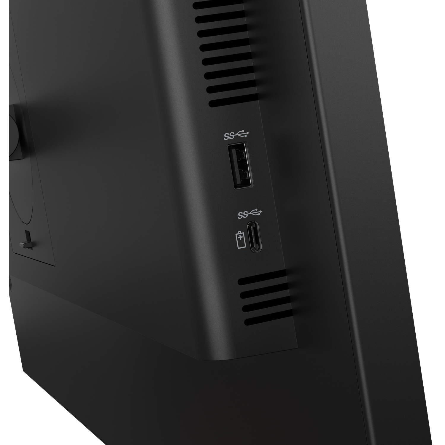 Close-up van een zwarte computer met USB-poorten en ventilatieopeningen.