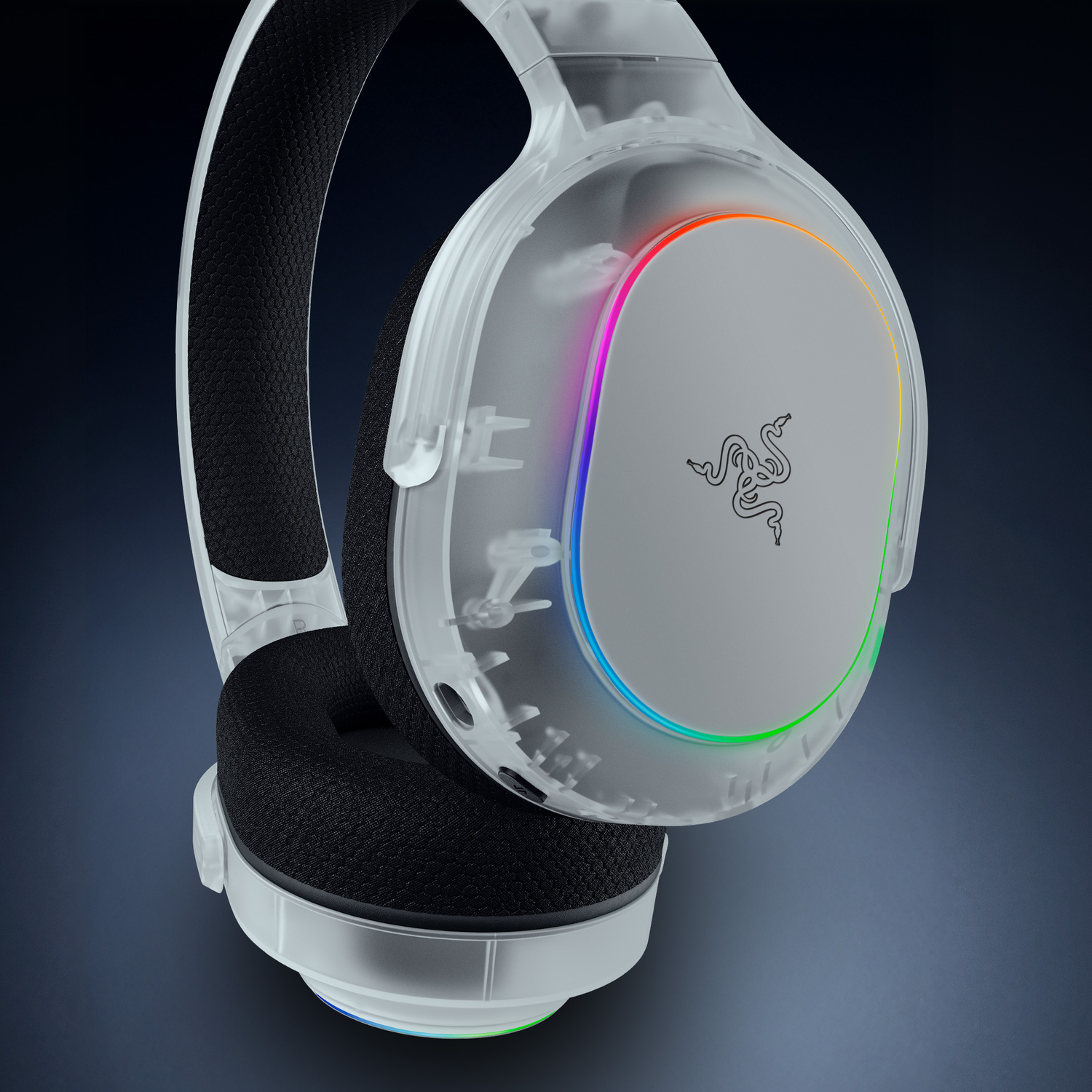 Transparent headphones with white Razer logo and colorful LEDs on a dark background.