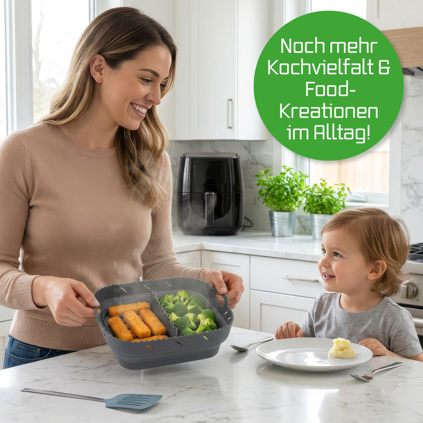 Frau und Kind in Küche mit Dampfgarbehälter, Brokkoli und Fischstäbchen.