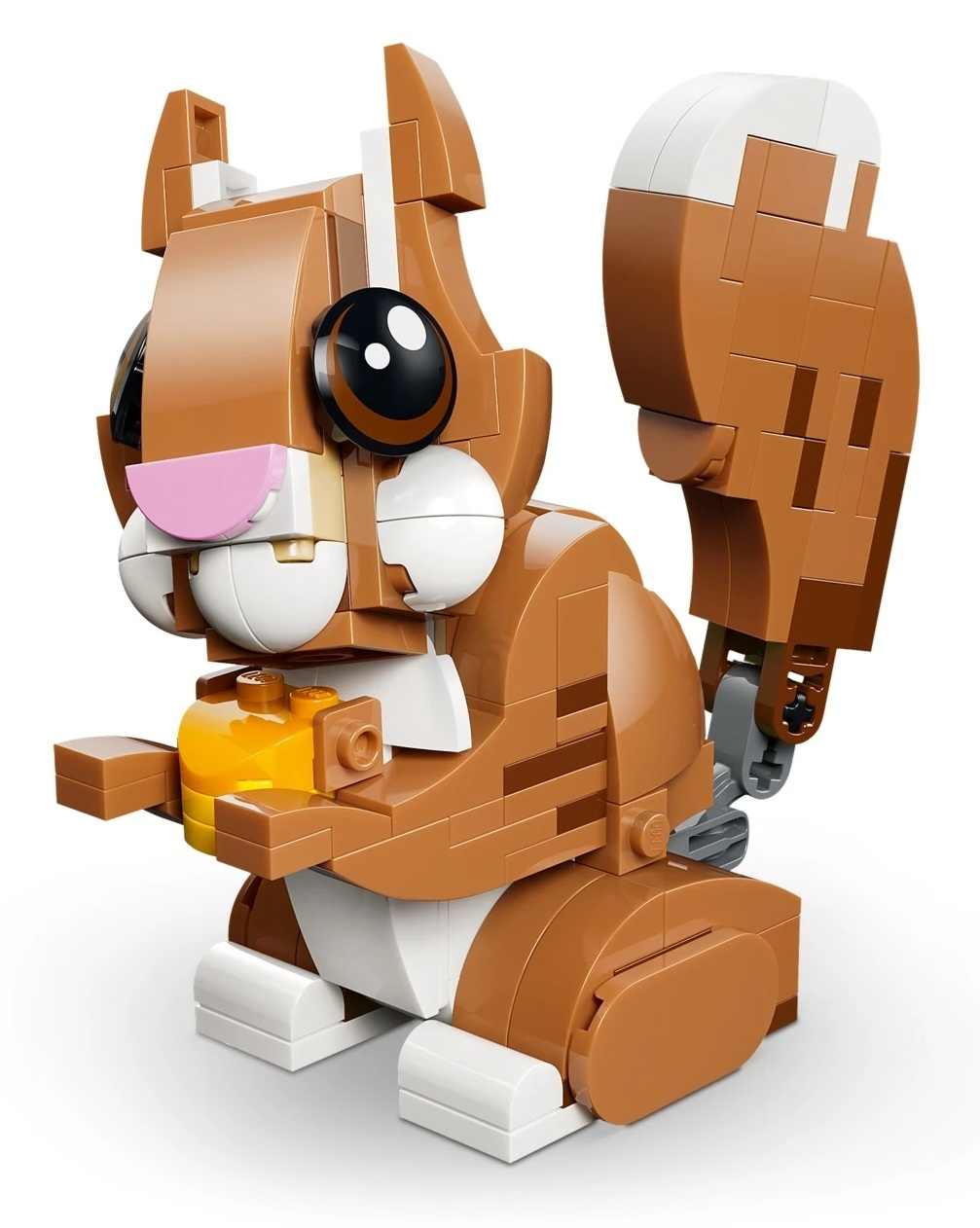 Brązowy zestaw Lego w kształcie wiewiórki z dużymi oczami i żółtym przedmiotem.