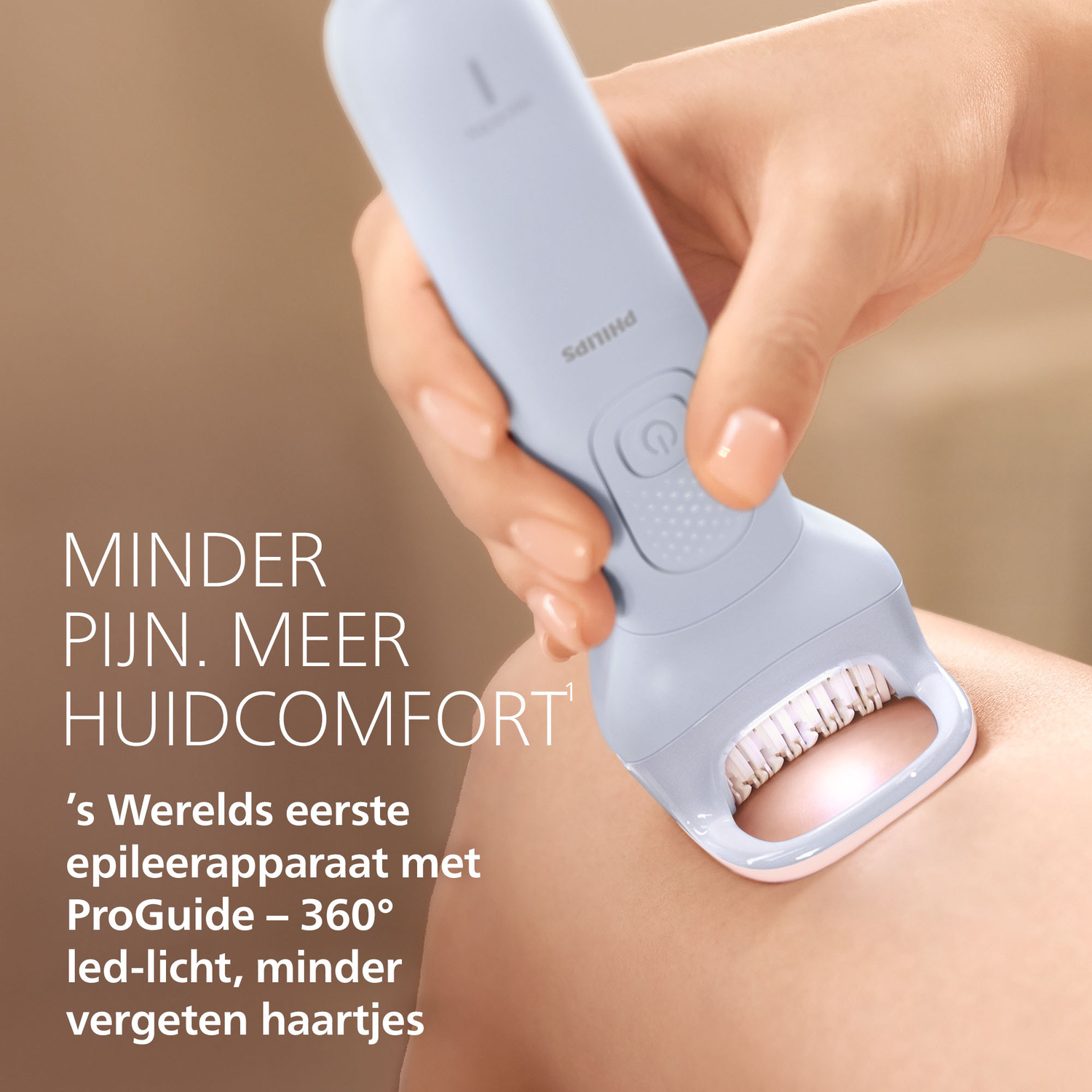 A hand holds a light blue Philips epilator over skin.