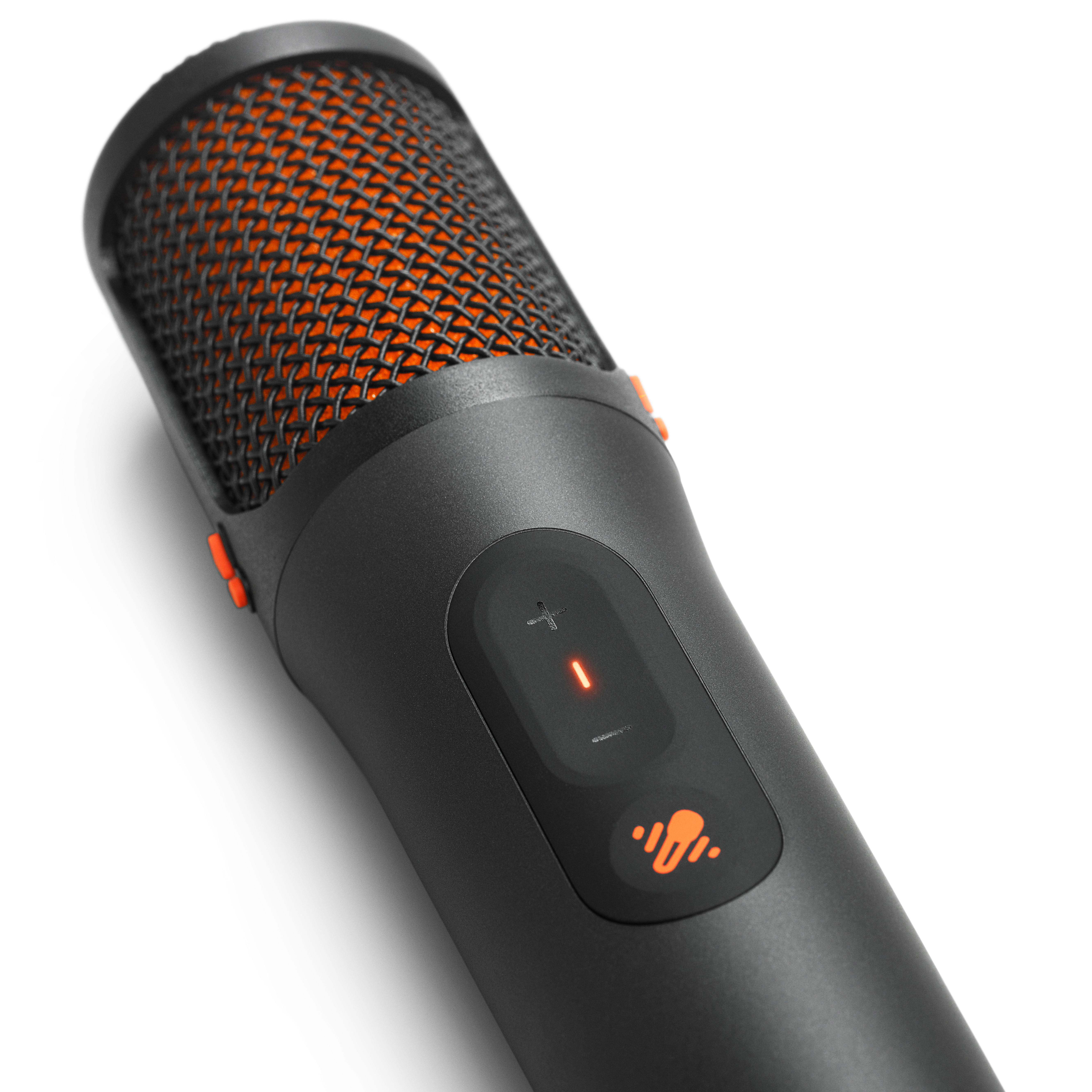 Ein schwarzes Mikrofon mit orangefarbenem Gitter und Bedienelementen.