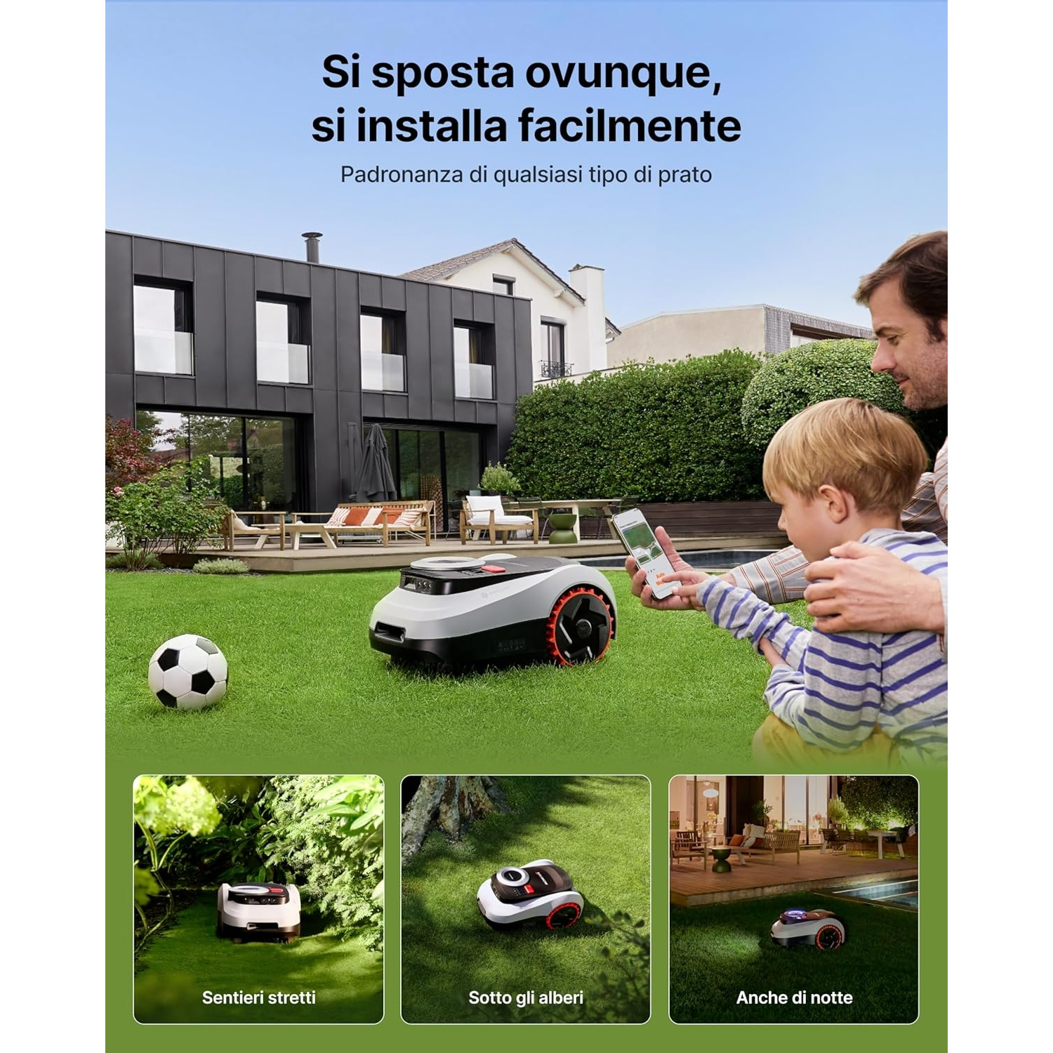 Un uomo e un bambino controllano un robot tosaerba tramite smartphone in giardino.