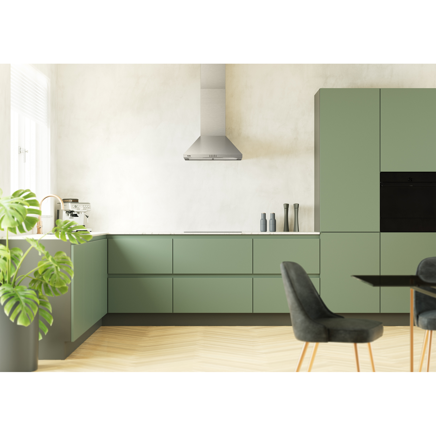 Moderne keuken met saliegroene kasten, roestvrijstalen afzuigkap en plant.