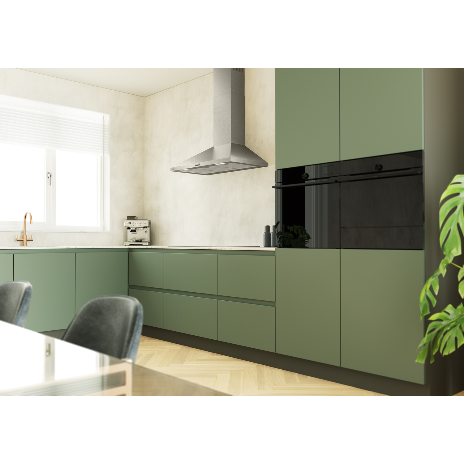 Moderne groene keuken met afzuigkap, koffiezetapparaat en inbouwovens.