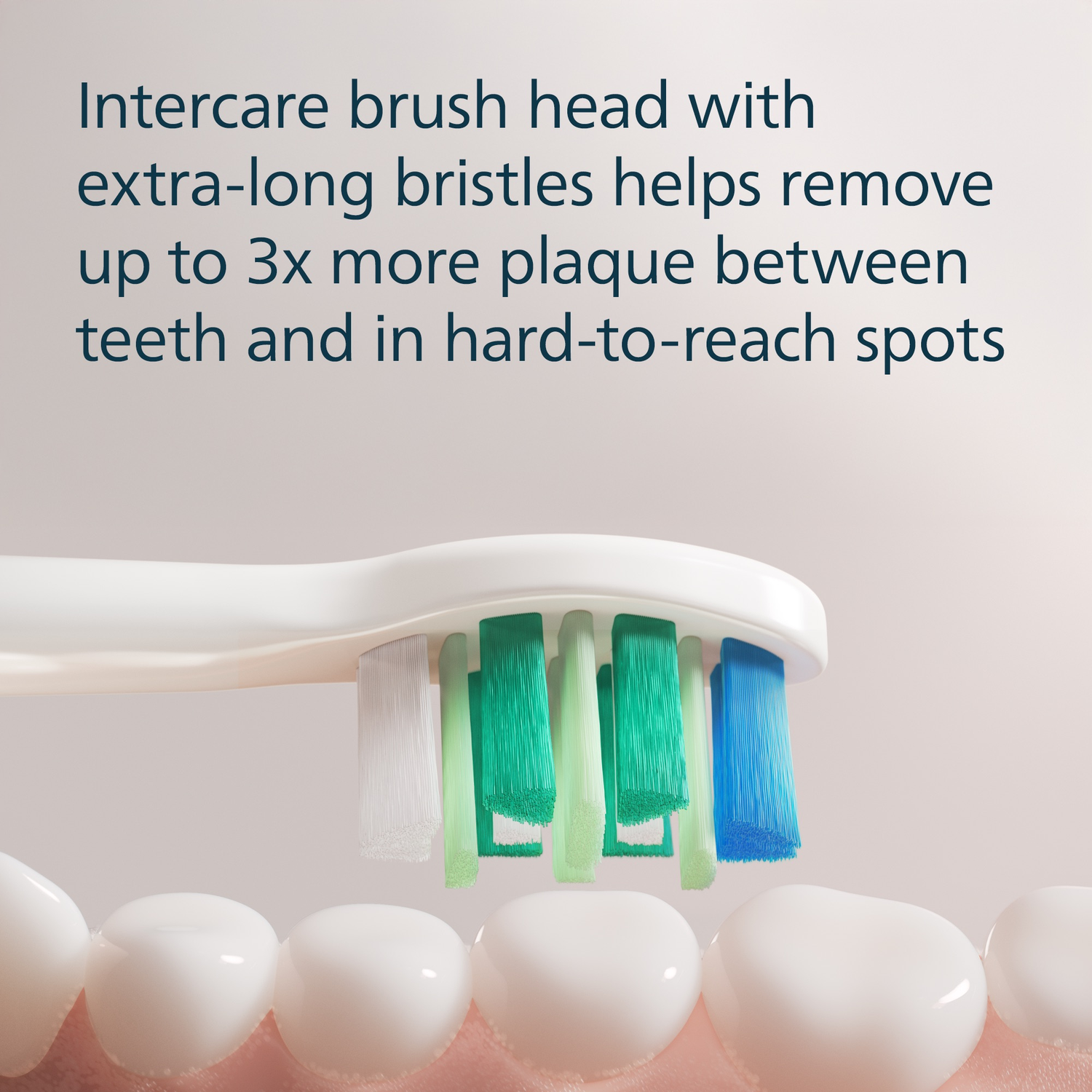 Close-up of a toothbrush head with multi-colored bristles cleaning teeth.
