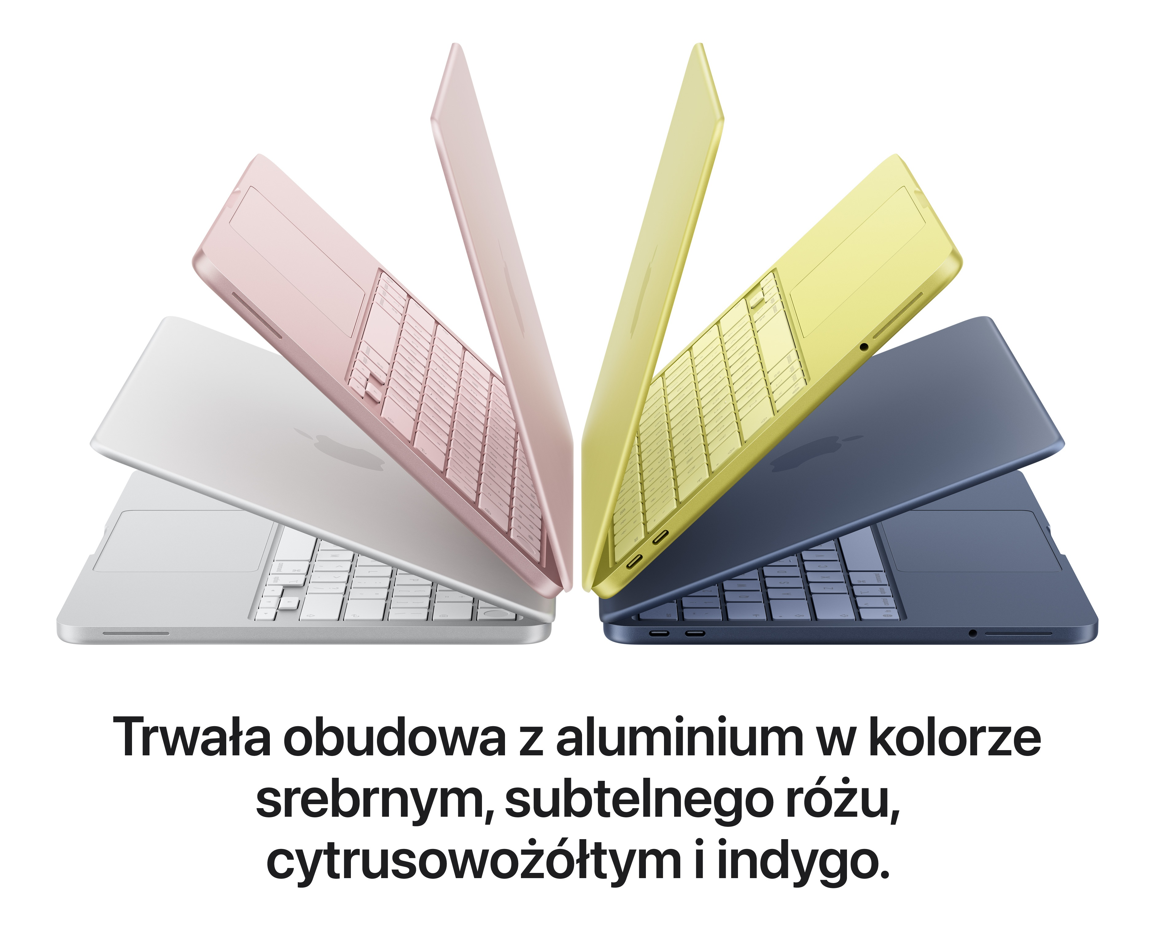 Laptopy w kolorach srebrnym, różowym, żółtym i indygo na białym tle.