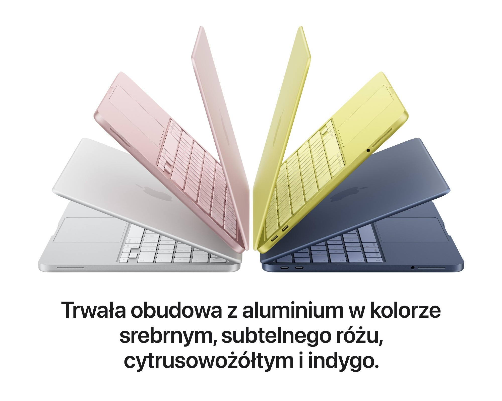Cztery laptopy w kolorach srebrnym, różowym, żółtym i indygo na białym tle.