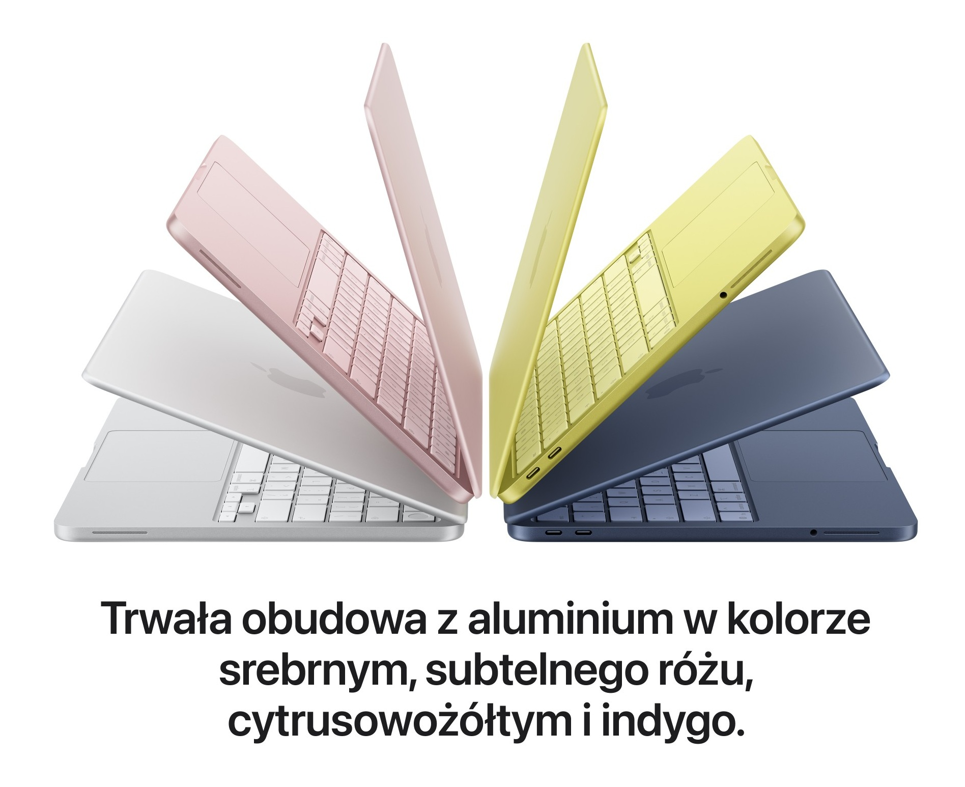 Cztery laptopy otwarte: srebrny, różowy, żółty i granatowy.