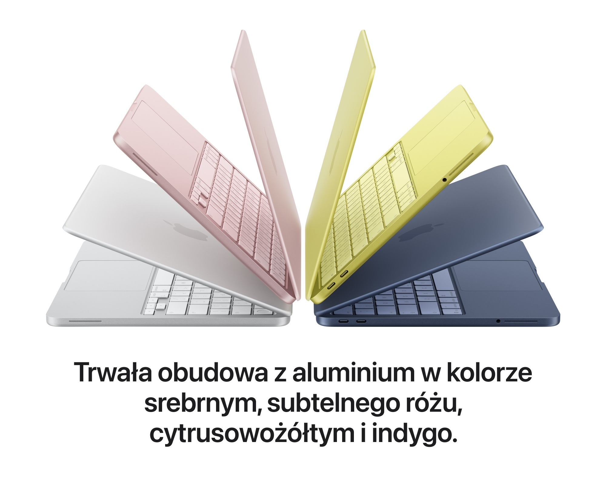Cztery laptopy w kolorach srebrnym, różowym, żółtym i indygo na białym tle.