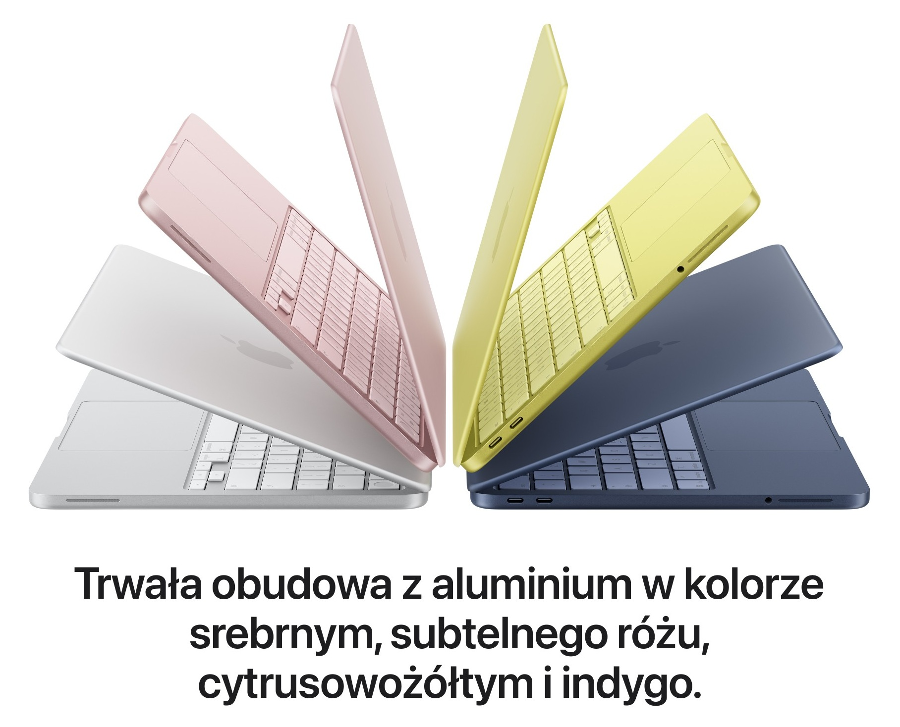 Cztery laptopy w kolorach srebrnym, różowym, żółtym i indygo ułożone wachlarzowo.