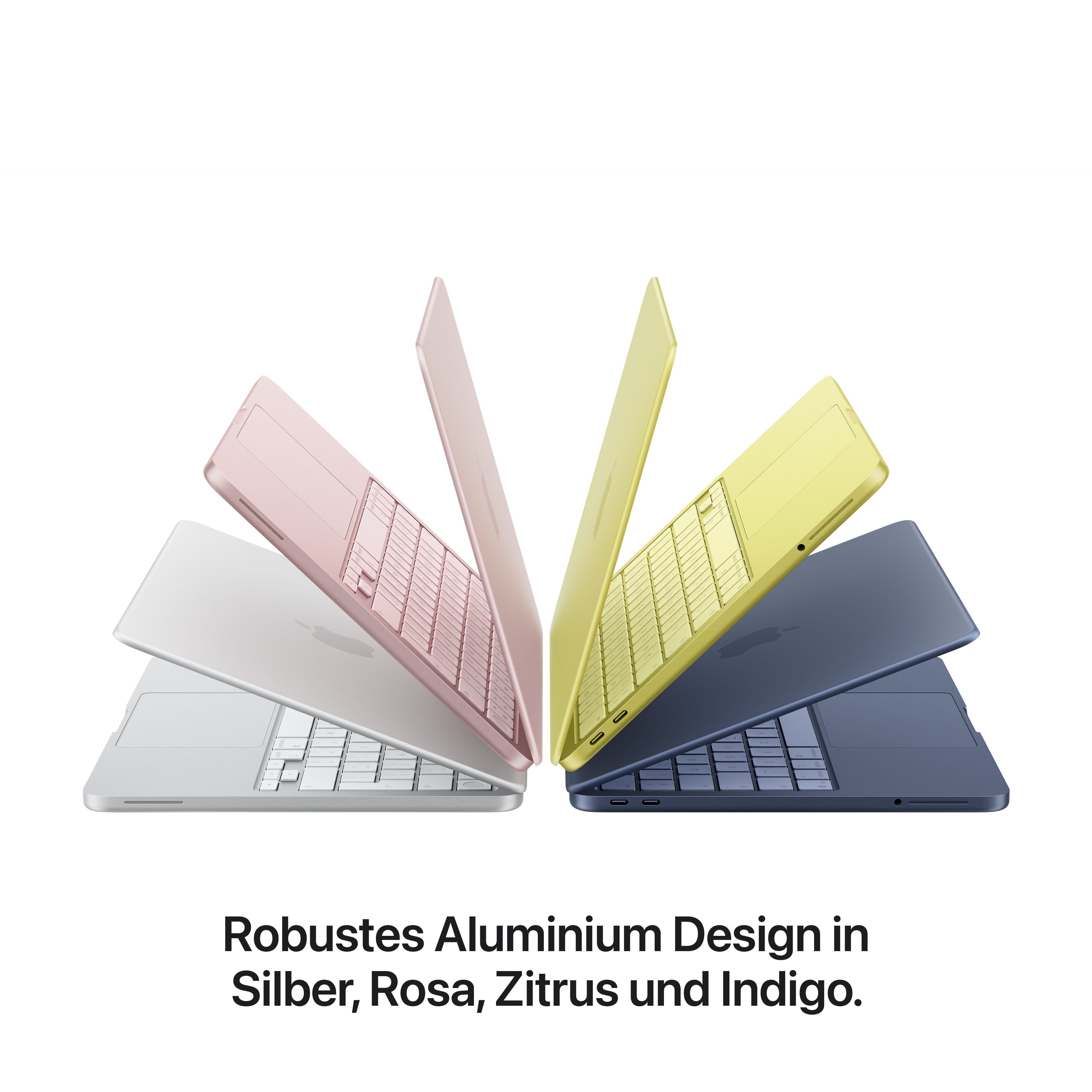 Vier Laptops in Rosa, Gelb, Blau und Silber, auf weißem Grund.