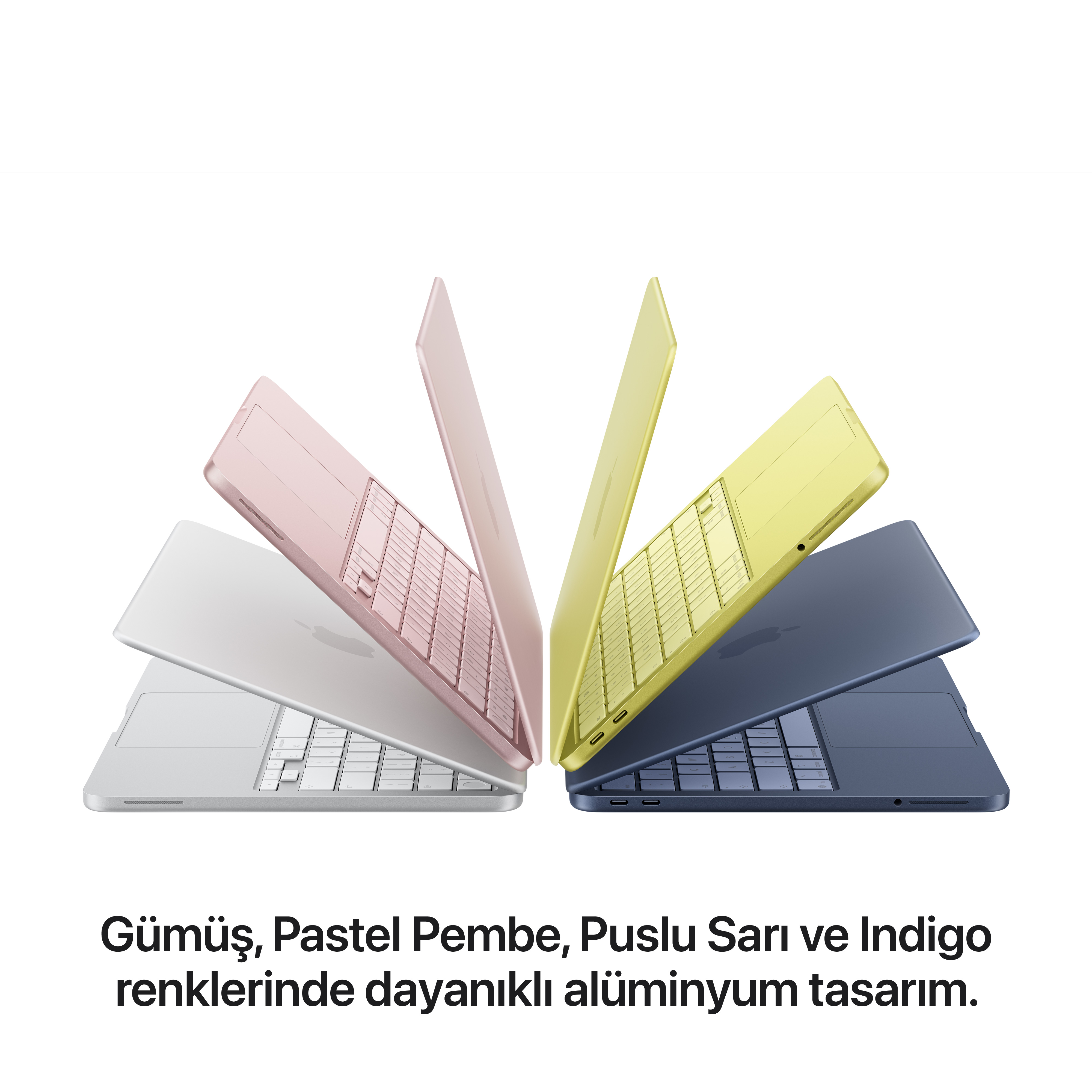 Gümüş, pastel pembe, puslu sarı ve indigo renkli dört laptop.