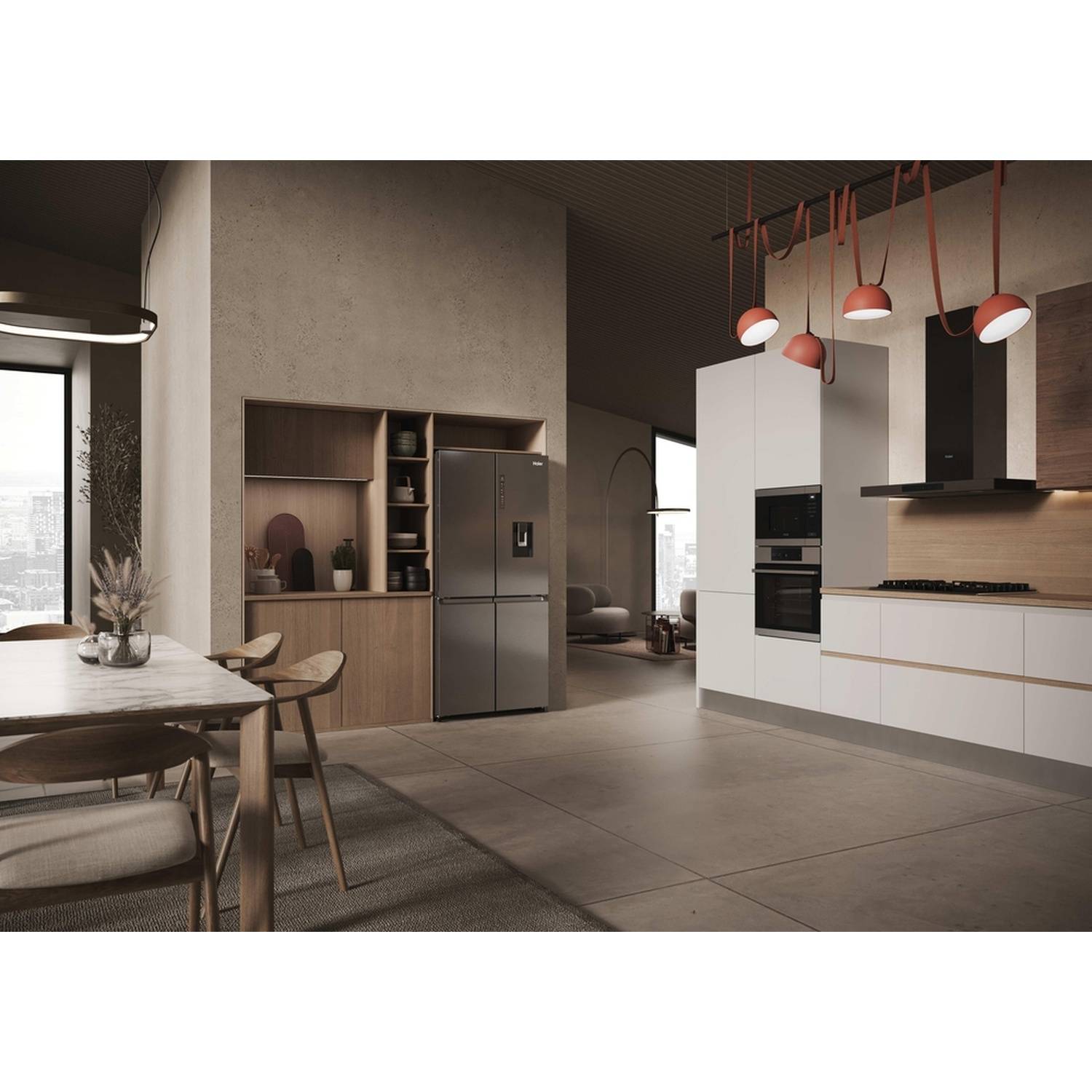 Cucina moderna con zona pranzo, frigorifero, forni e piano cottura.