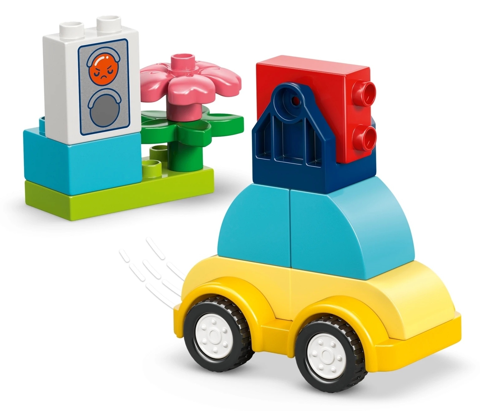 Kolorowe klocki: Żółty samochód jedzie obok kwiatka ze złą miną.