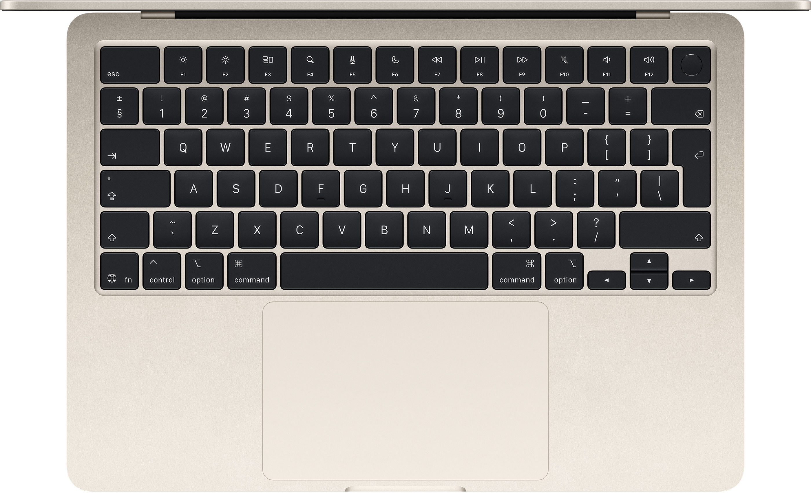 Világos arany laptop billentyűzet és érintőpad közelről.