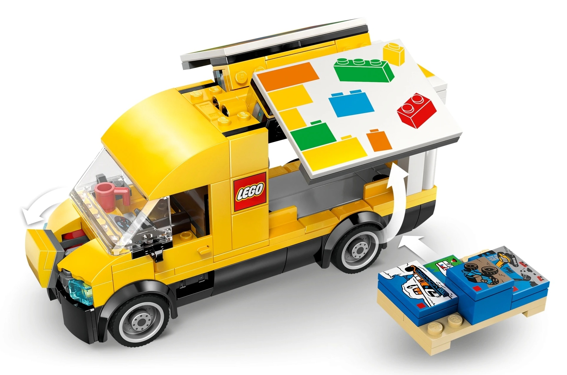 Żółta ciężarówka Lego z kolorową tablicą wystawową i bazą zabawk.