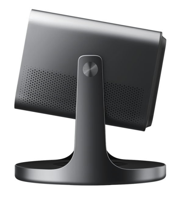 Widok z tyłu szarego monitora na okrągłej podstawie z wzorem otworów.