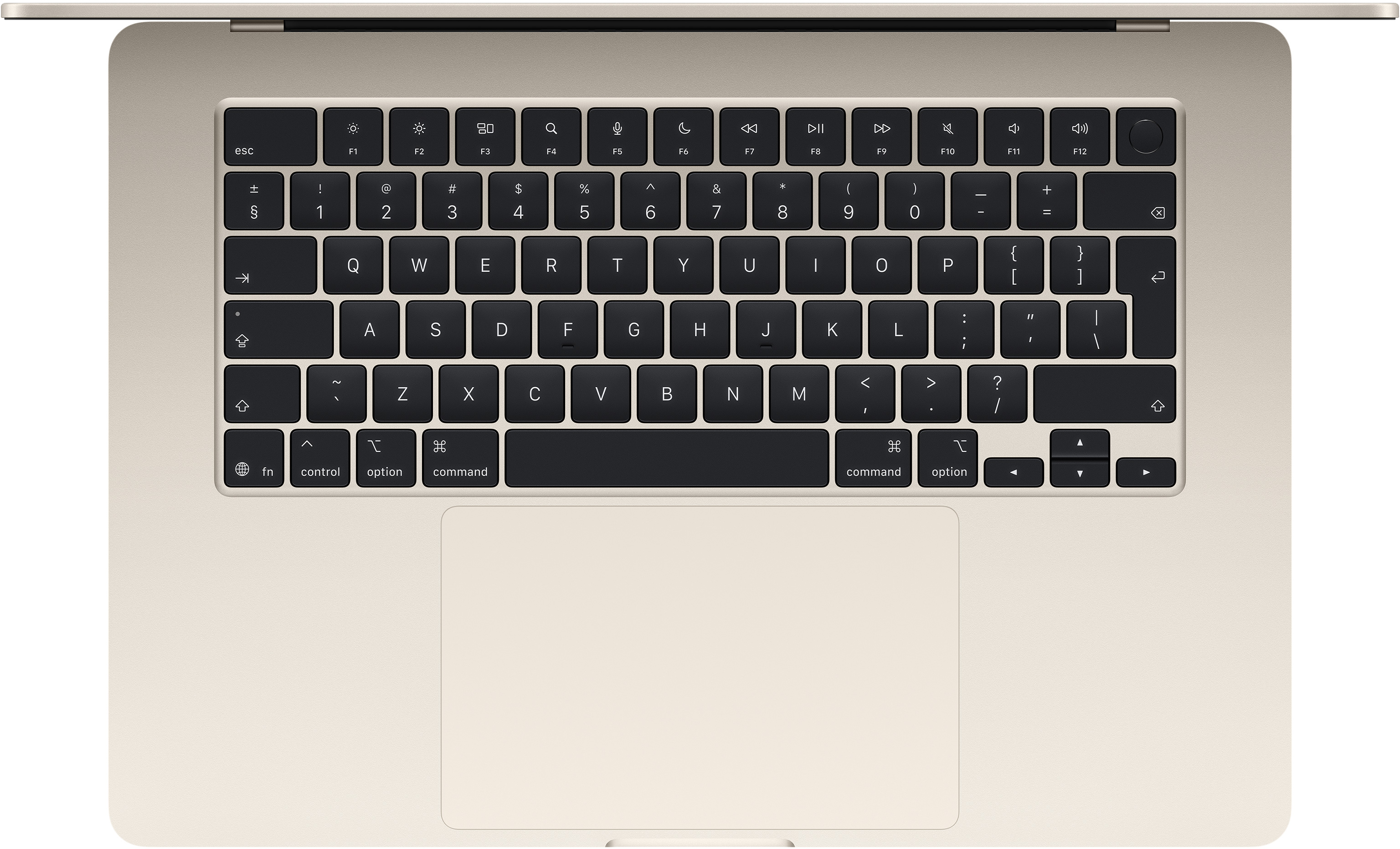 Világosbézs laptop billentyűzet és touchpad közeli képe.