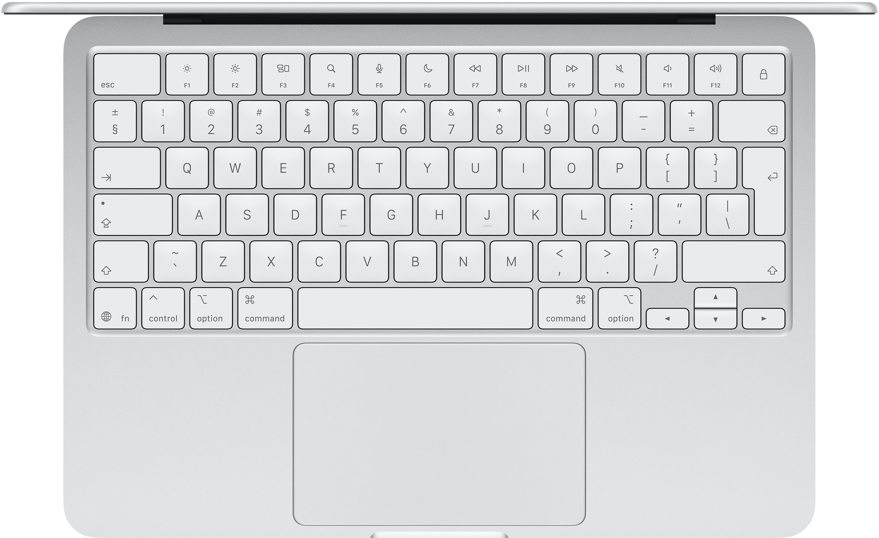 Ezüst laptop billentyűzet és érintőpad közeli képe.