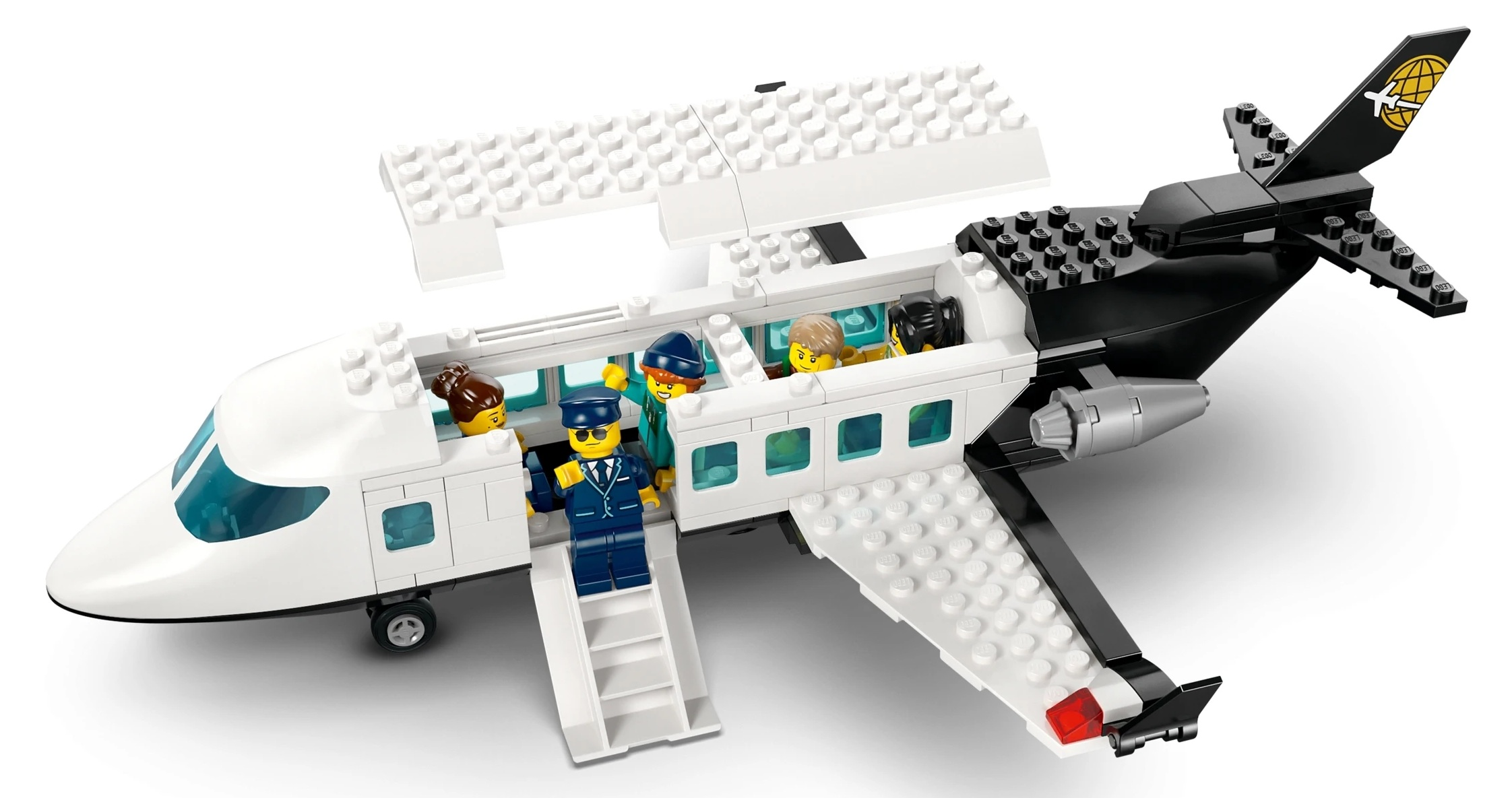 Samolot Lego z pilotem i pasażerami, biały z czarnym ogonem, otwarty do oglądania.