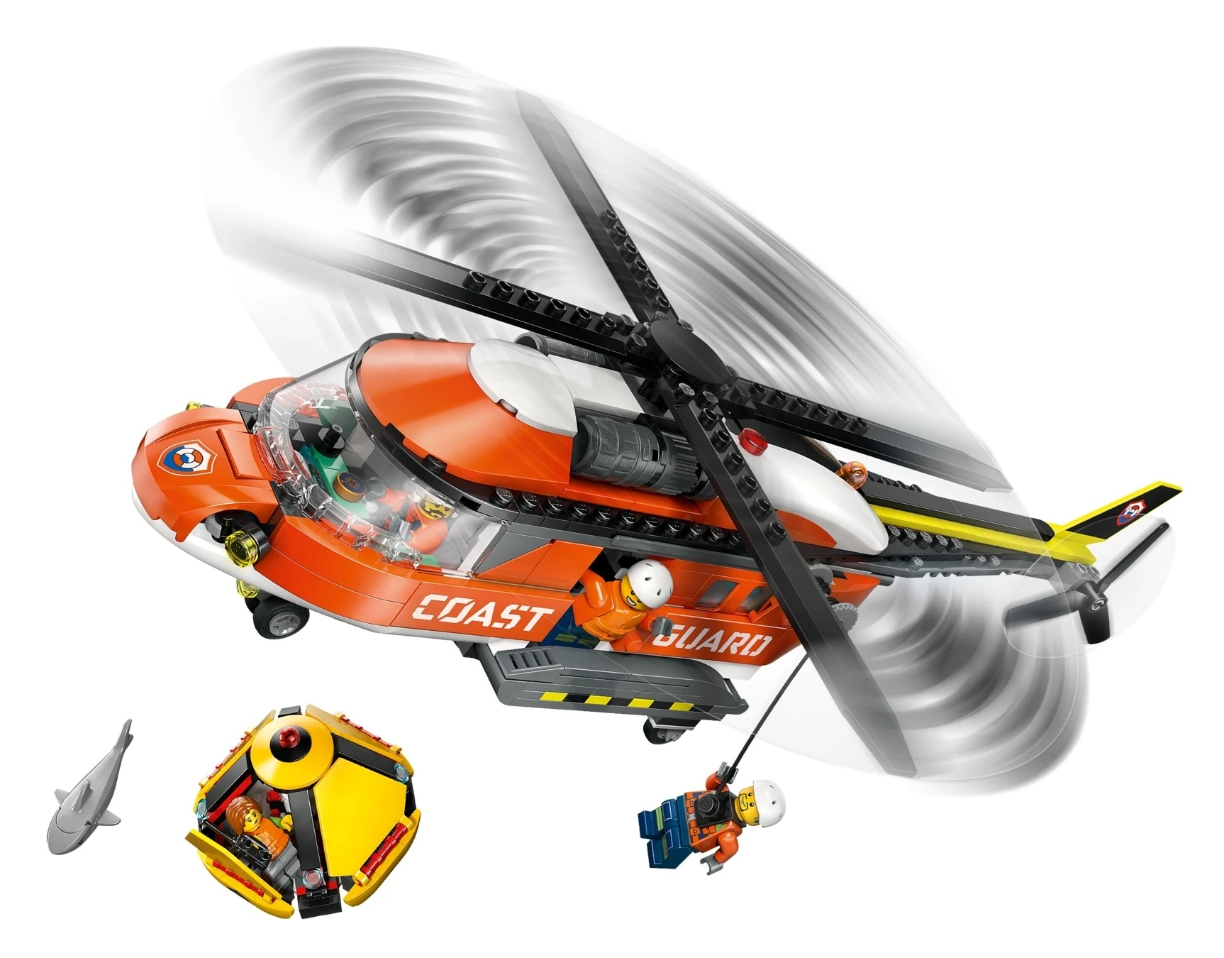 Pomarańczowo-biały helikopter Straży Przybrzeżnej z napisem "COAST GUARD" wciąga człowieka na linie.