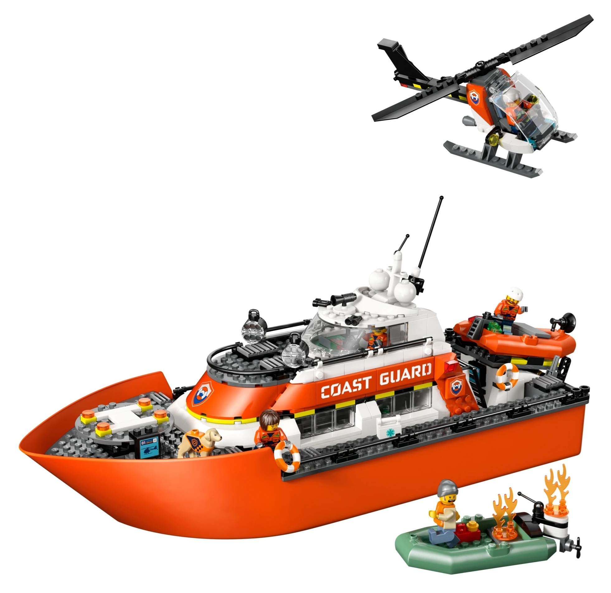 Pomarańczowa łódź straży przybrzeżnej z helikopterem i pontonem.