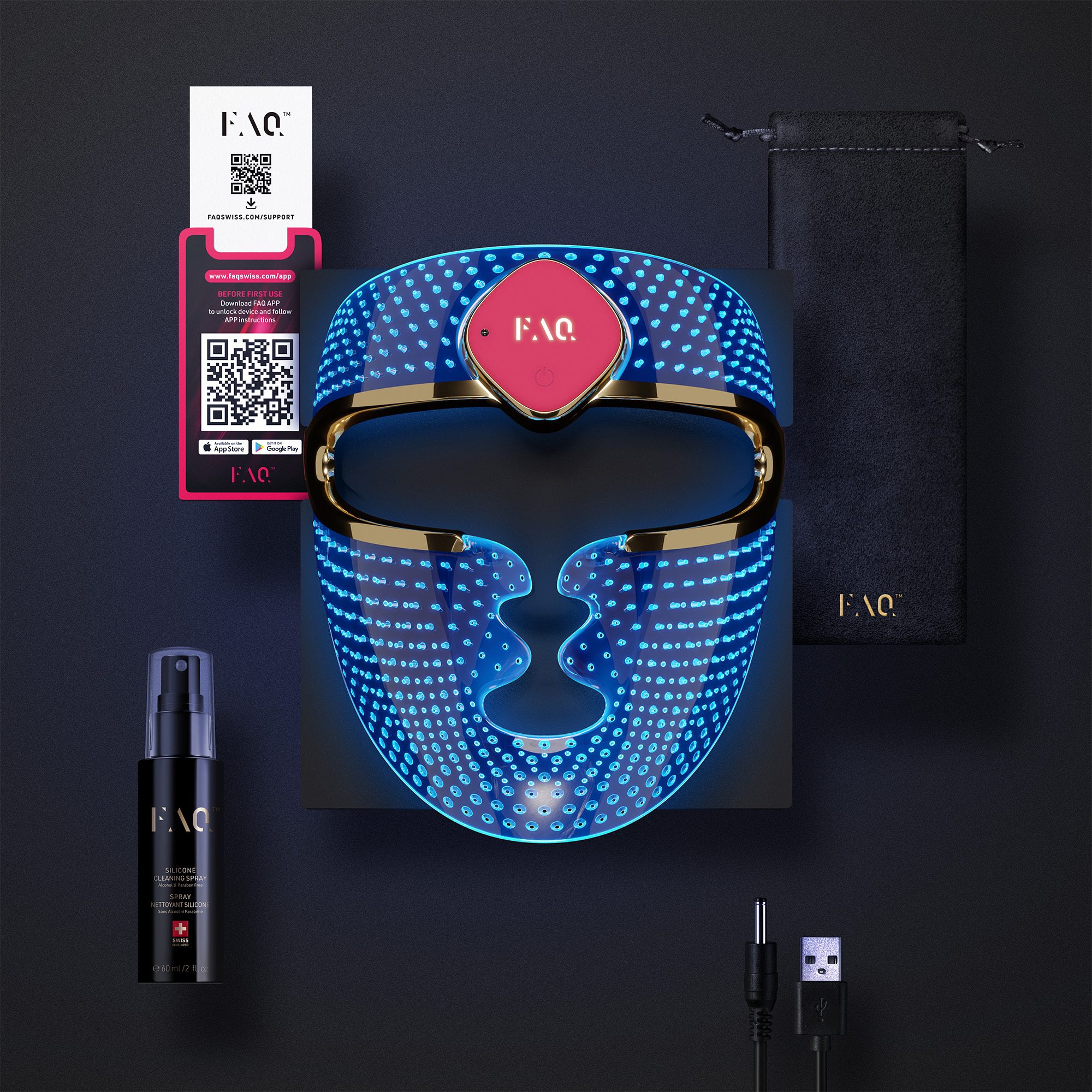 Un dispositivo facial LED azul con ribete dorado, accesorios y spray limpiador.