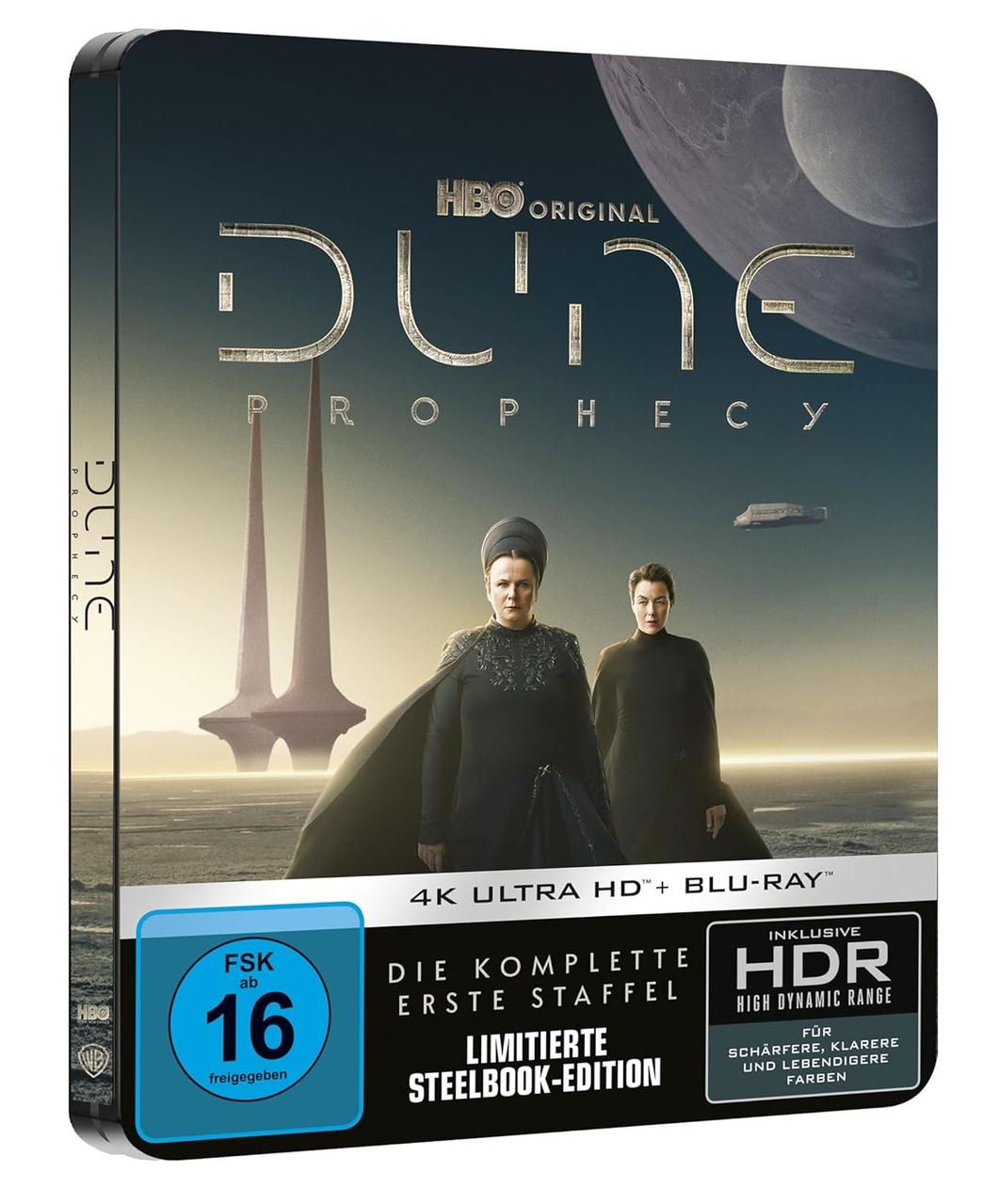 Steelbook-Edition von Dune: Prophecy mit zwei Frauen im Vordergrund und futuristischen Türmen.