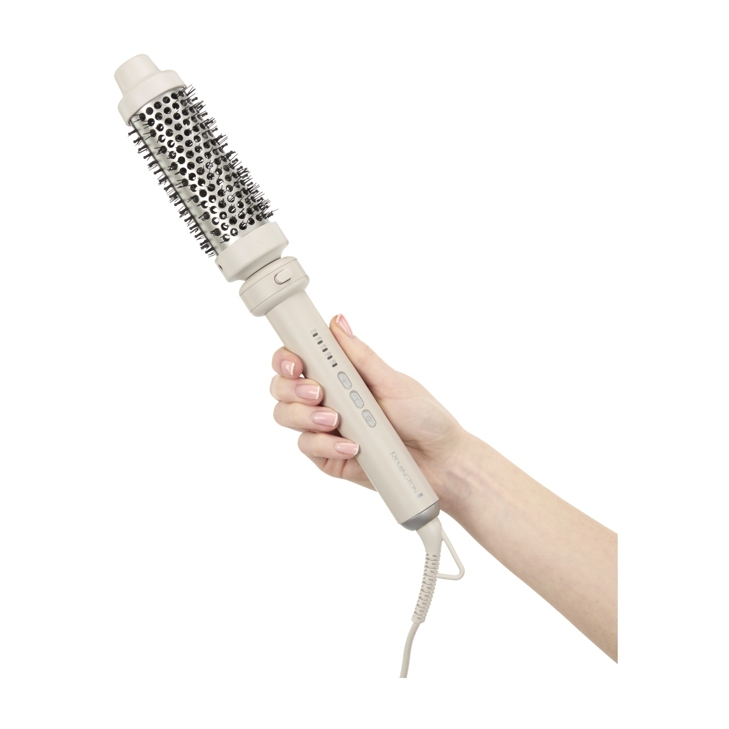 Una mano tiene una spazzola asciugacapelli beige con setole nere e prese d'aria argentate.