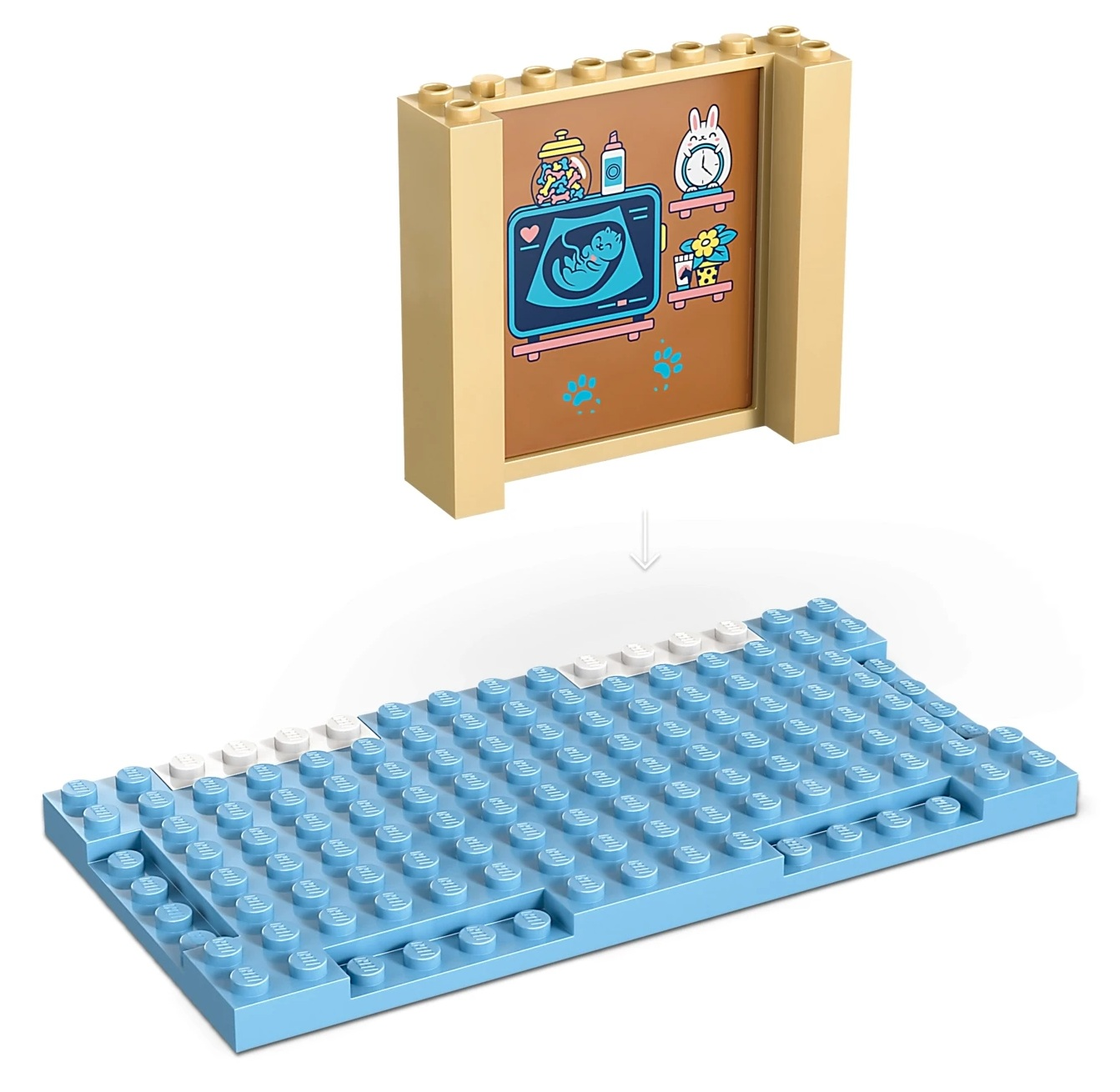 Model LEGO pokazuje ekran USG z dzieckiem i niebieską podstawą z klocków.