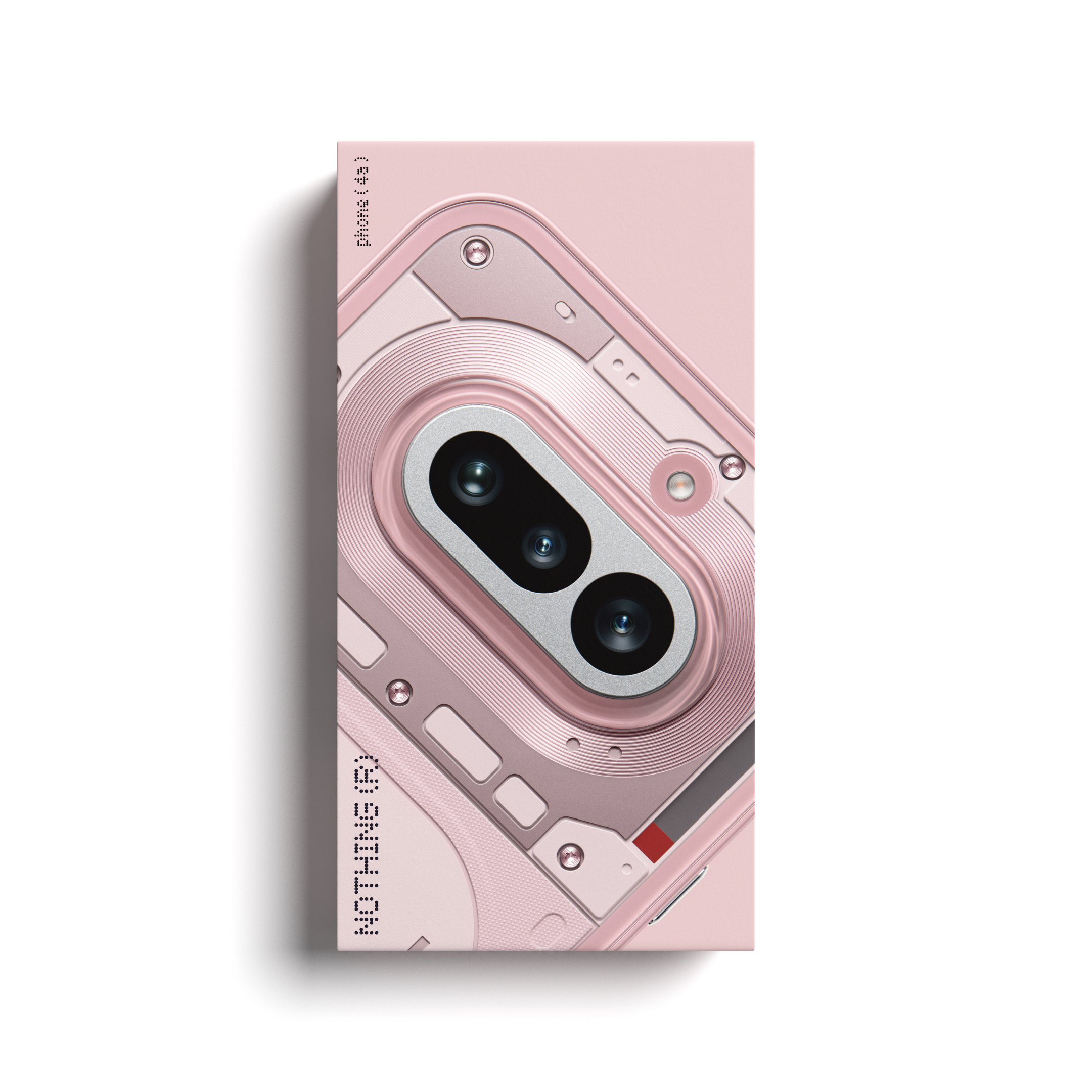 Une boîte rose avec un téléphone sur une surface blanche.