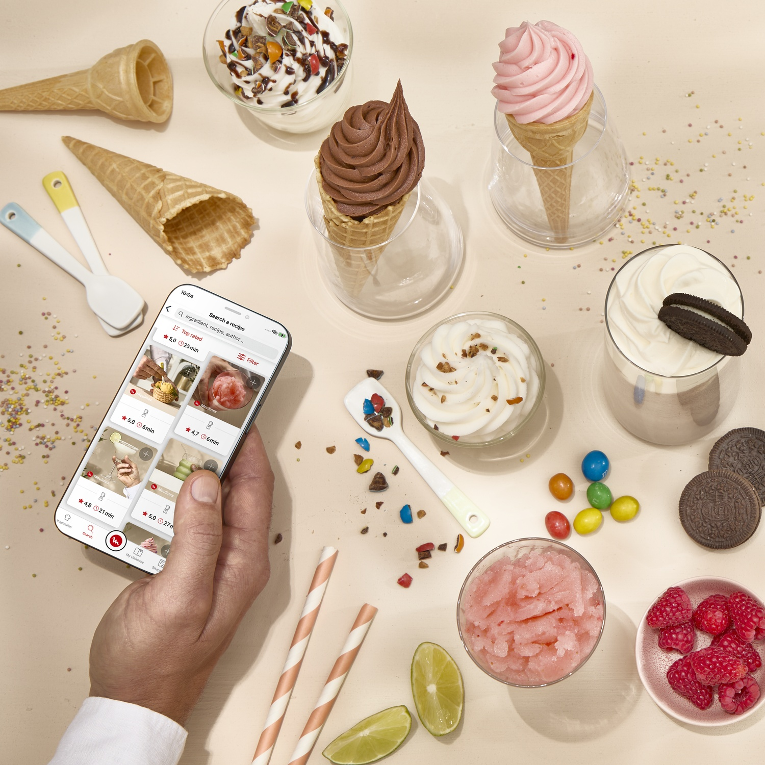 Ice cream ingredients, a hand holding a smartphone, and cooking utensils.