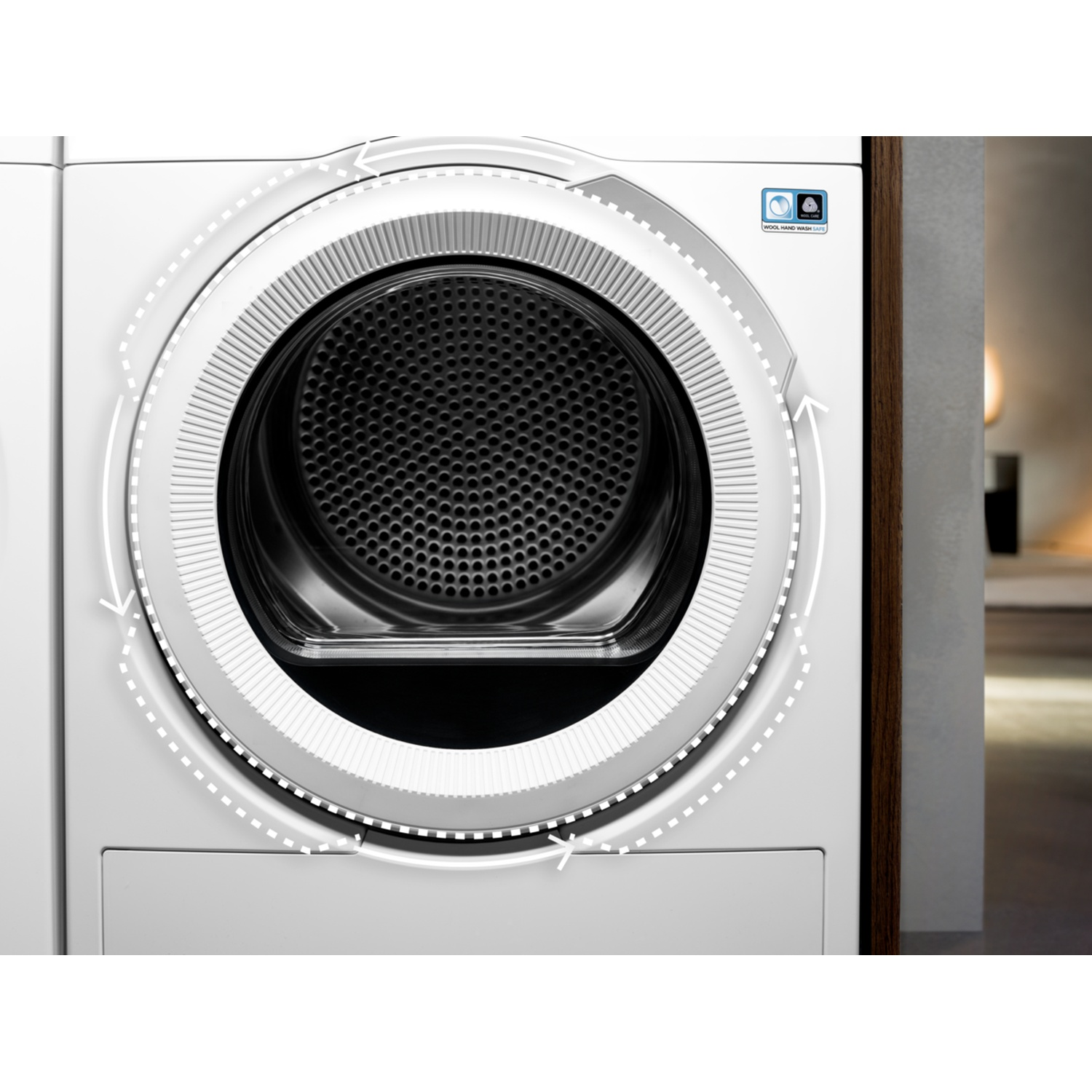 White washing machine with open drum and arrow design.