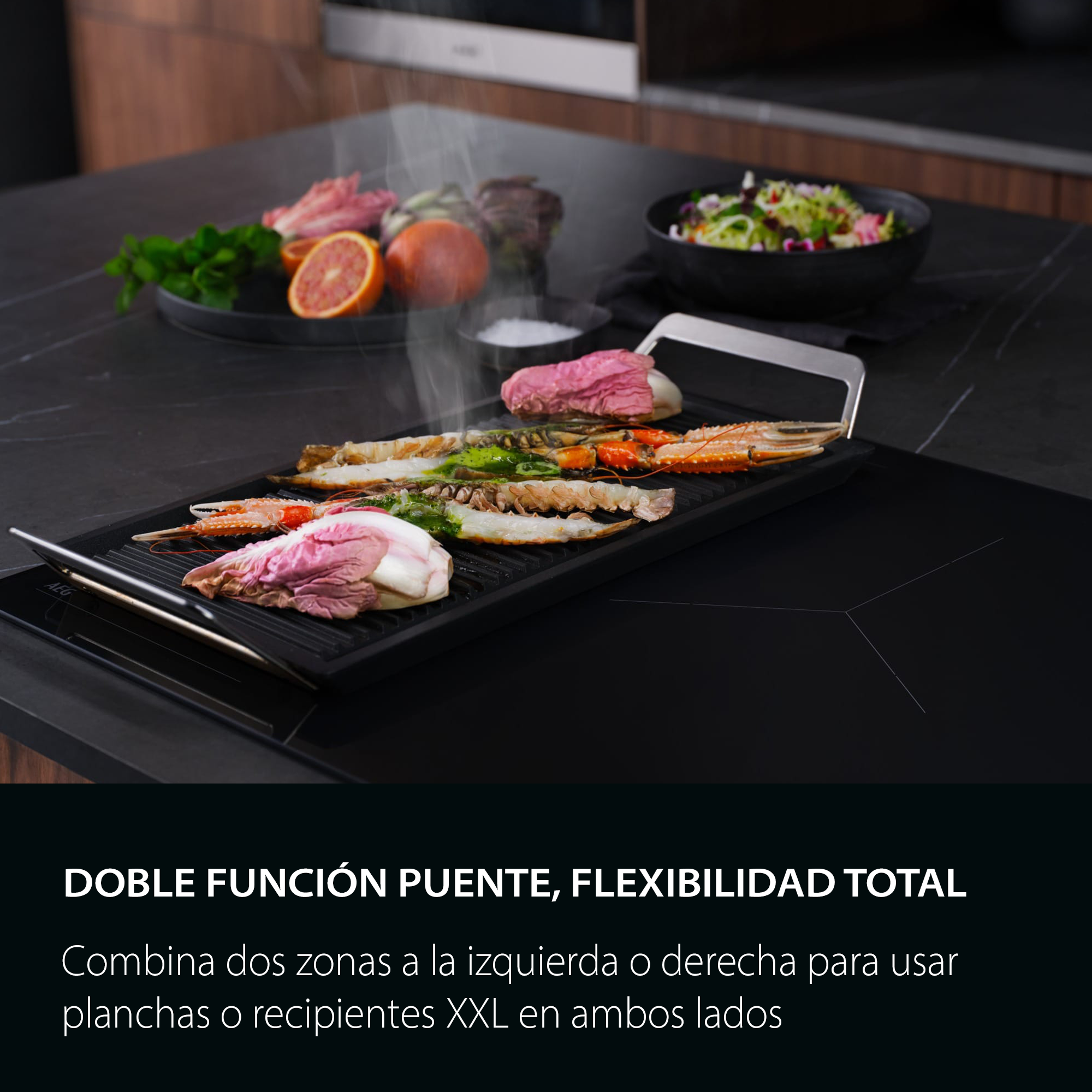 DOBLE FUNCIÓN PUENTE, FLEXIBILIDAD TOTAL
Combina dos zonas a la izquierda o derecha para usar planchas o recipientes XXL en ambos lados