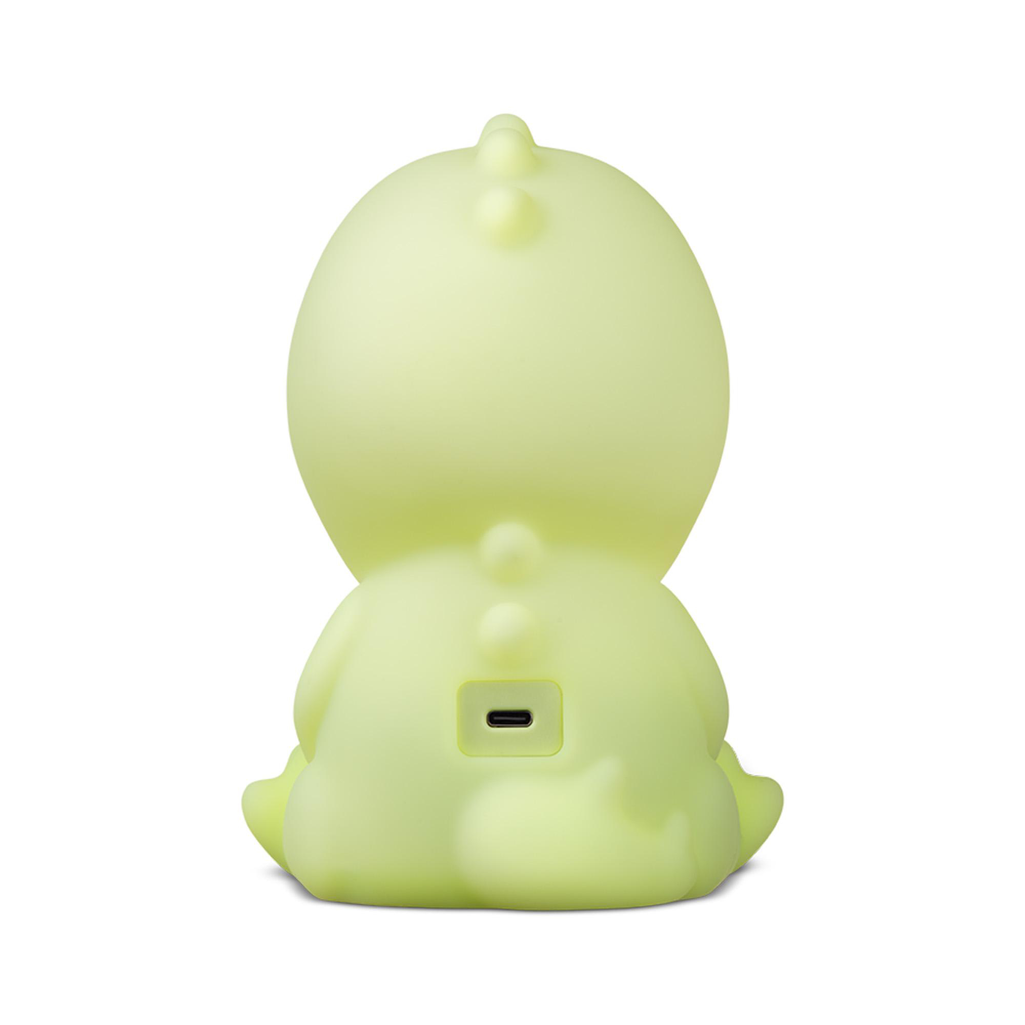 Hellgrüne Dinosaurierlampe mit USB-Anschluss, von hinten gesehen.